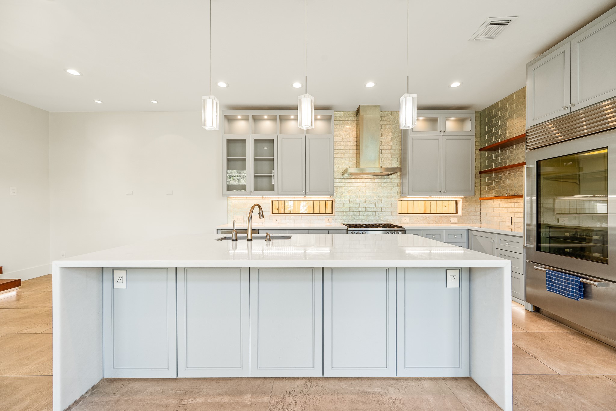 235 Malone Street Houston, TX 77007 - Photo 16 of 46 a kitchen with kitchen island granite countertop a sink and cabinets