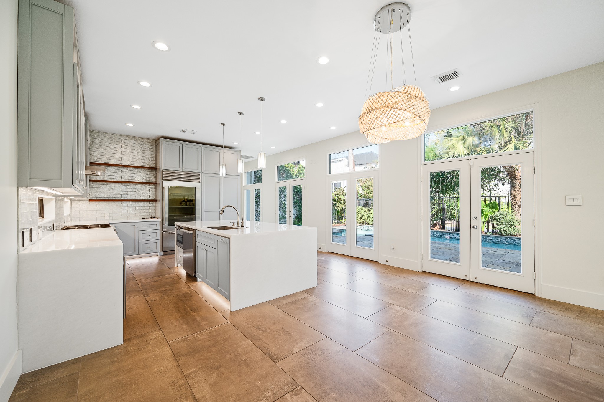 235 Malone Street Houston, TX 77007 - Photo 17 of 46 a view of a kitchen with furniture and refrigerator
