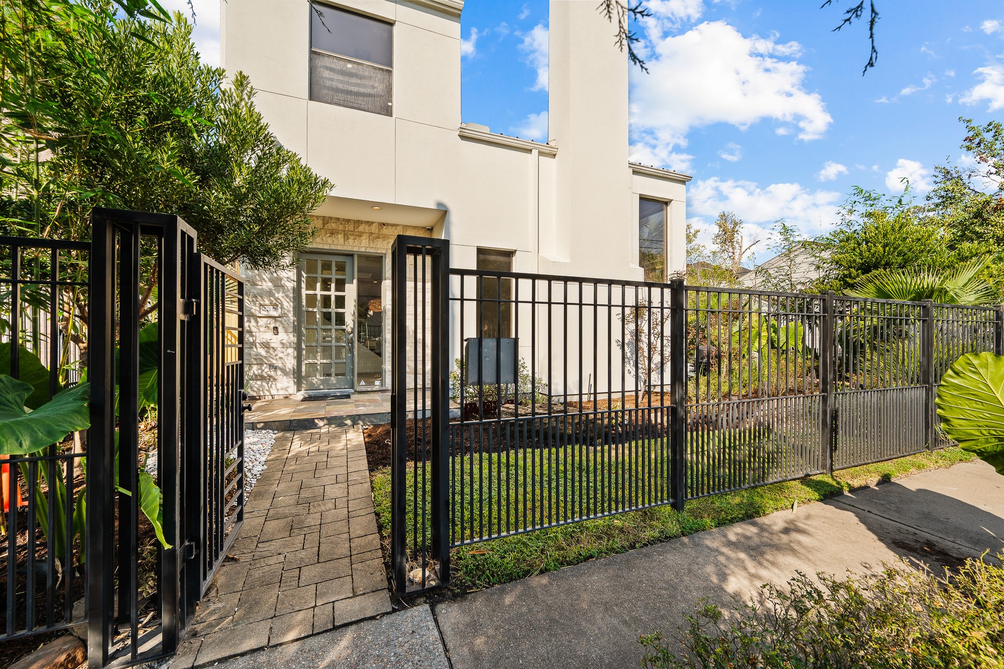 235 Malone Street Houston, TX 77007 - Photo 2 of 46 a view of a street with wooden fence