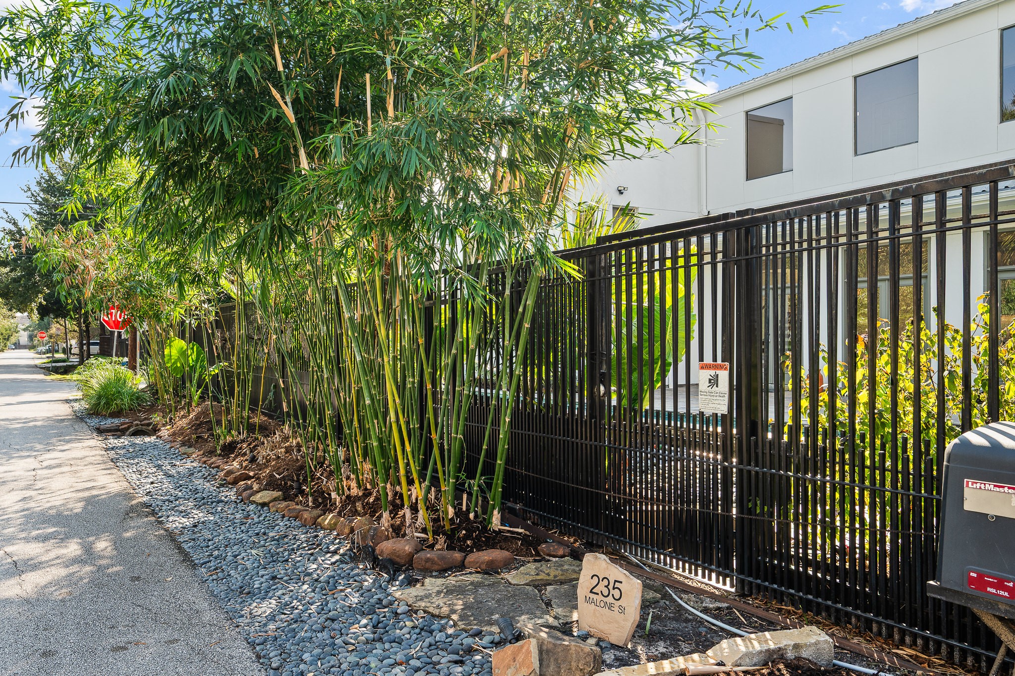 235 Malone Street Houston, TX 77007 - Photo 3 of 46 a view of a garden with a pathway