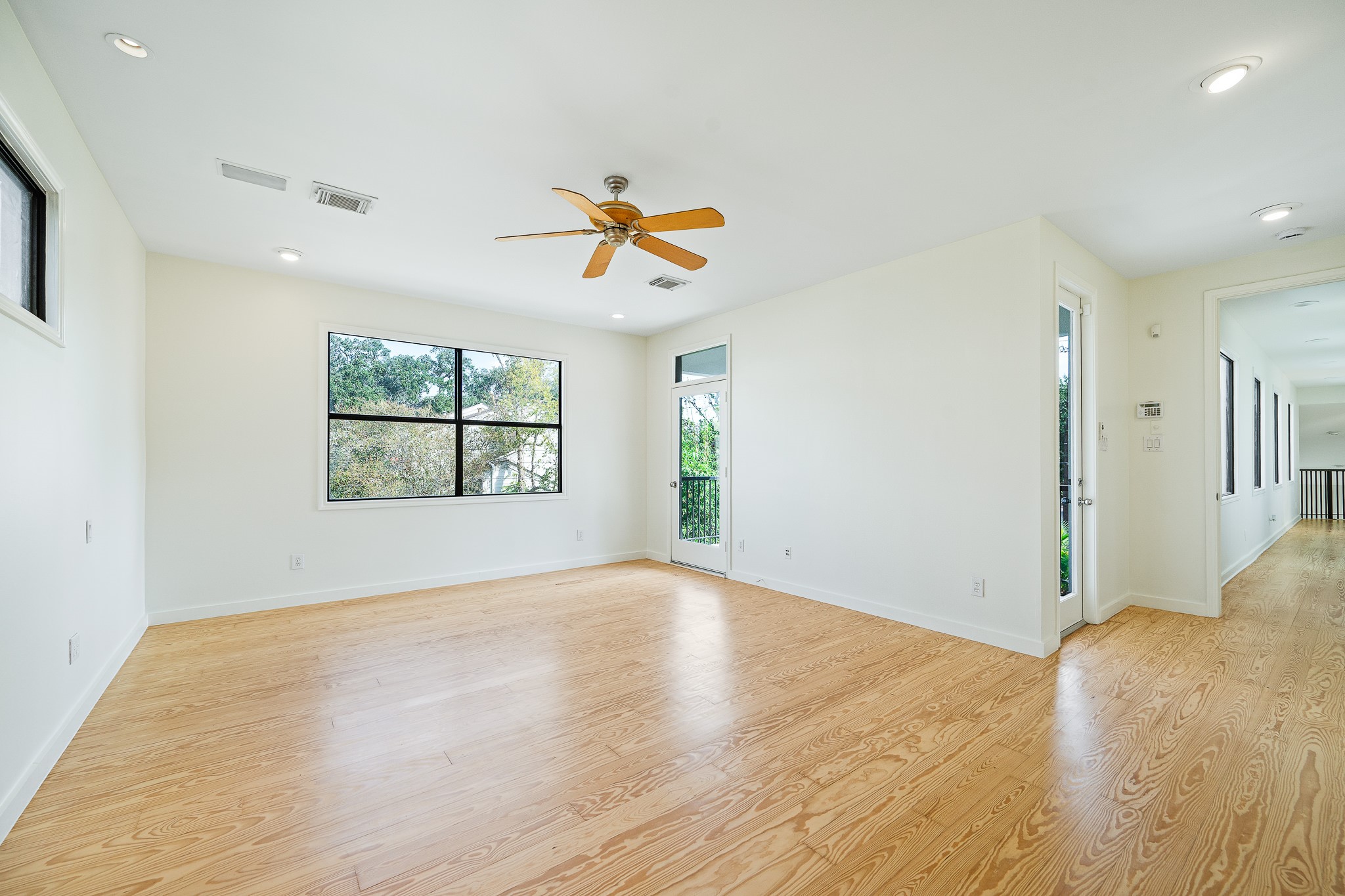 235 Malone Street Houston, TX 77007 - Photo 33 of 46 wooden floor in an empty room with a window