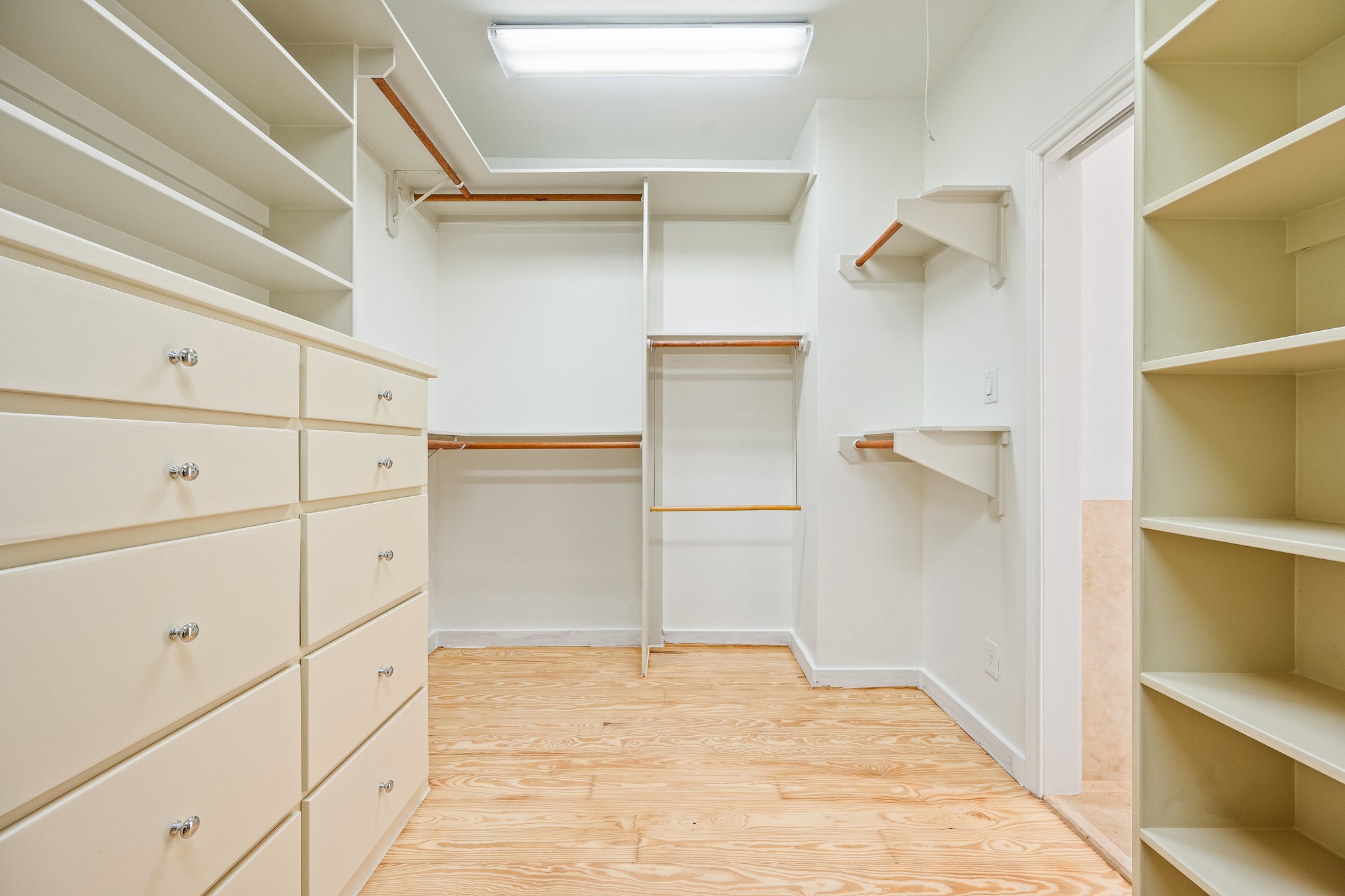 235 Malone Street Houston, TX 77007 - Photo 39 of 46 a view of walk in closet with empty racks