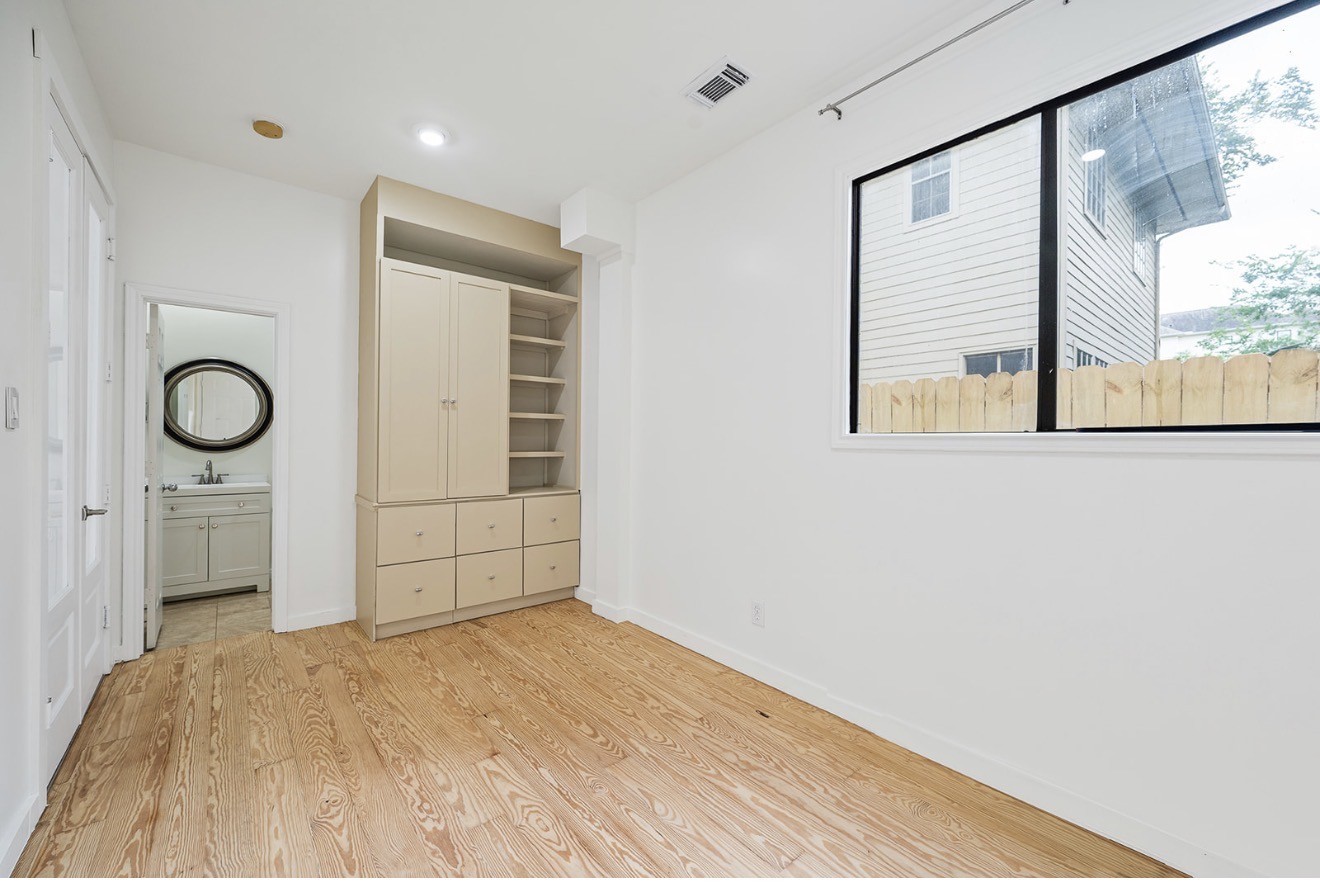 235 Malone Street Houston, TX 77007 - Photo 40 of 46 a view of a room with window and hardwood
