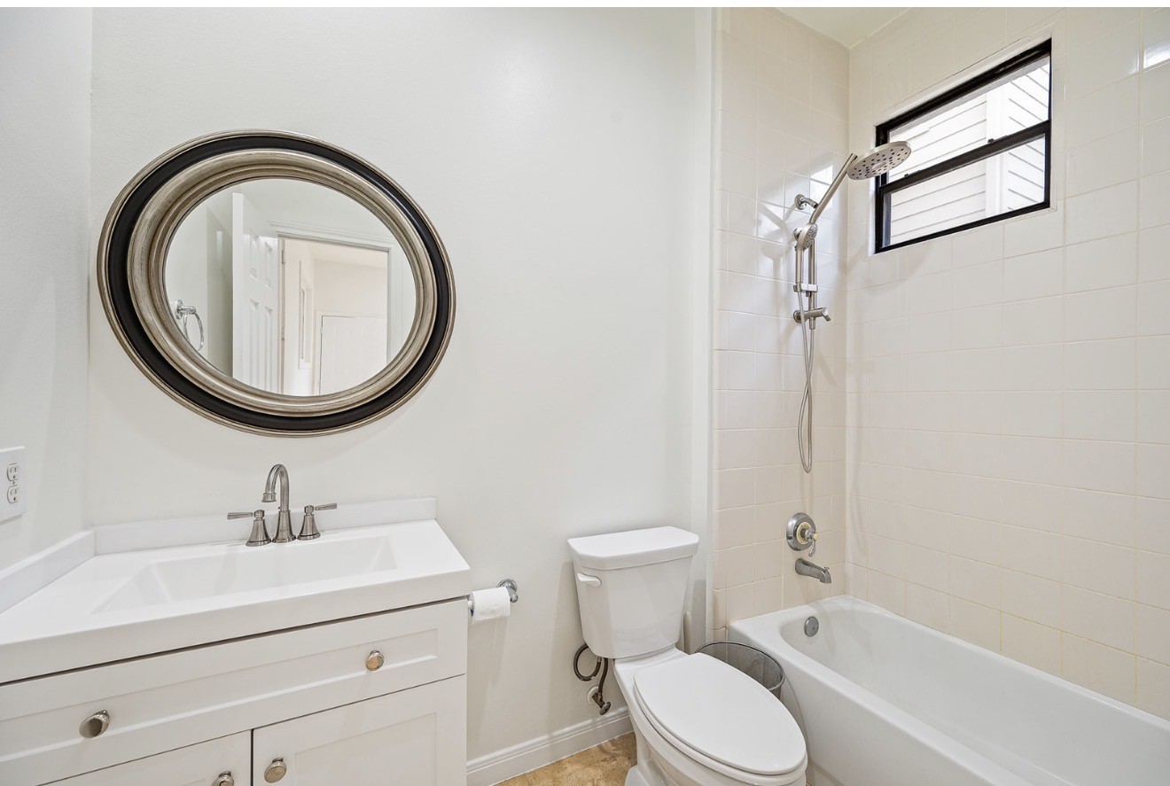 235 Malone Street Houston, TX 77007 - Photo 41 of 46 a bathroom with a sink a mirror and a toilet