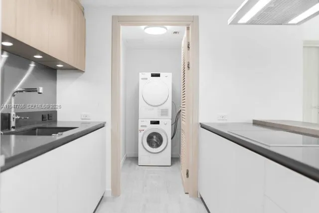 a view of a kitchen cabinets and a sink