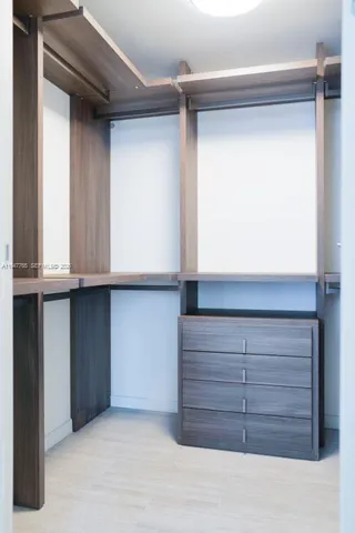 a view of an empty walk in closet