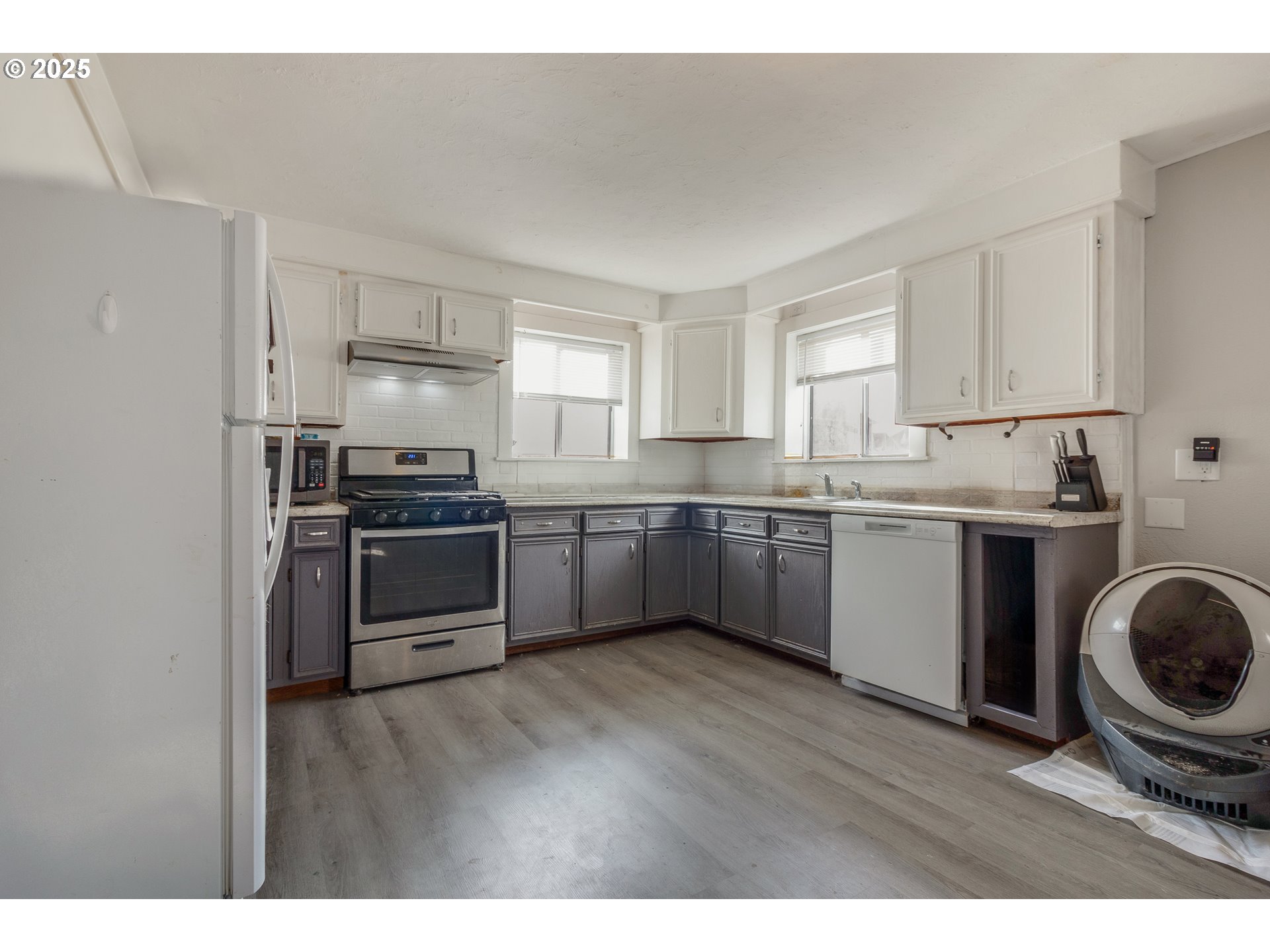 412 South 35th Street Springfield, OR 97478 - Photo 8 of 38 a kitchen with a sink a stove a refrigerator and cabinets
