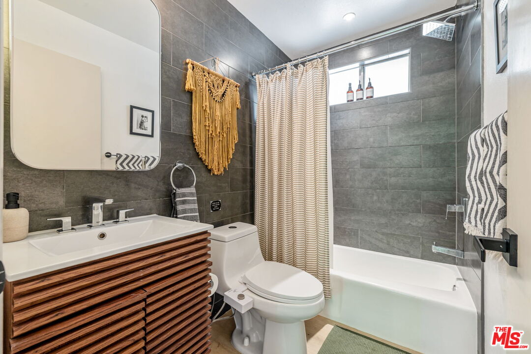 66869 San Ardo Road Desert Hot Springs, CA 92240 - Photo 29 of 39 a bathroom with a sink toilet and shower