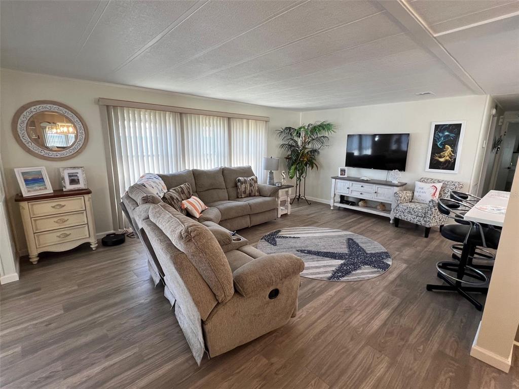 825 Coconut Palm Largo, FL 33778 - Photo 11 of 30 a living room with furniture and a flat screen tv