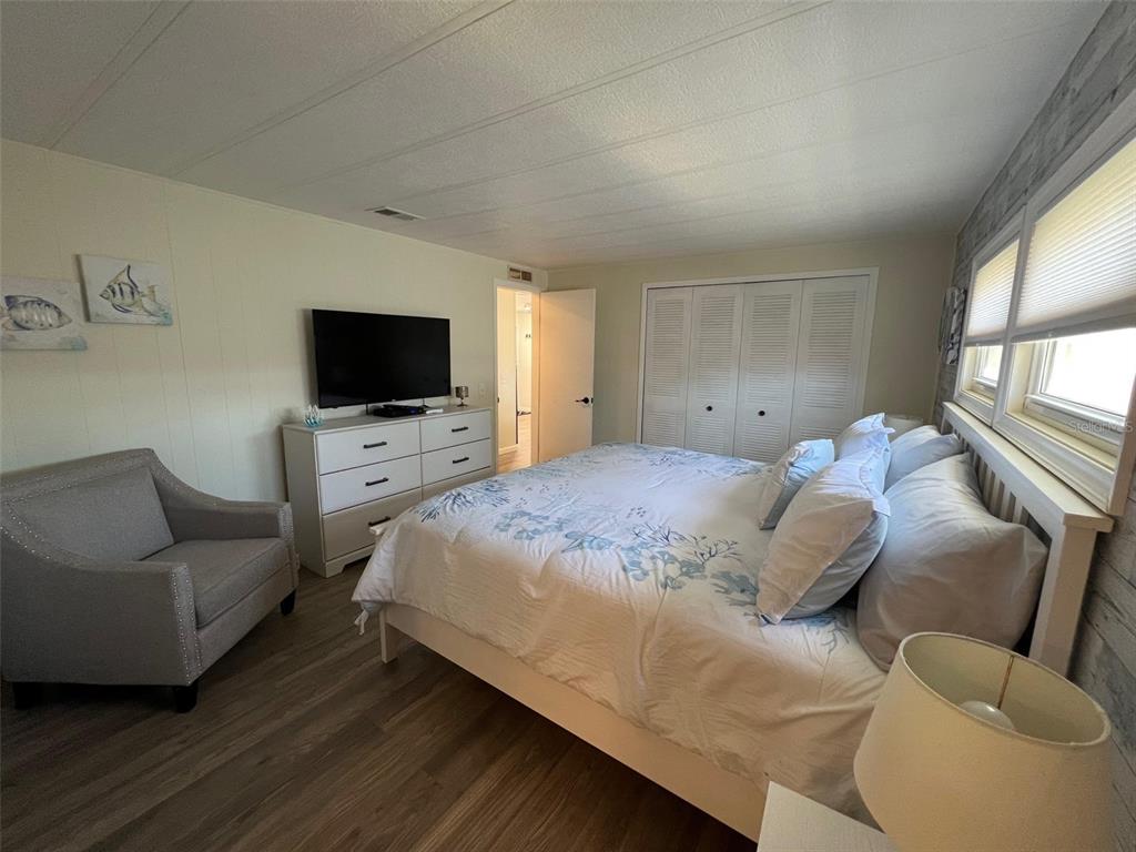 825 Coconut Palm Largo, FL 33778 - Photo 18 of 30 a bedroom with a bed and a flat screen tv