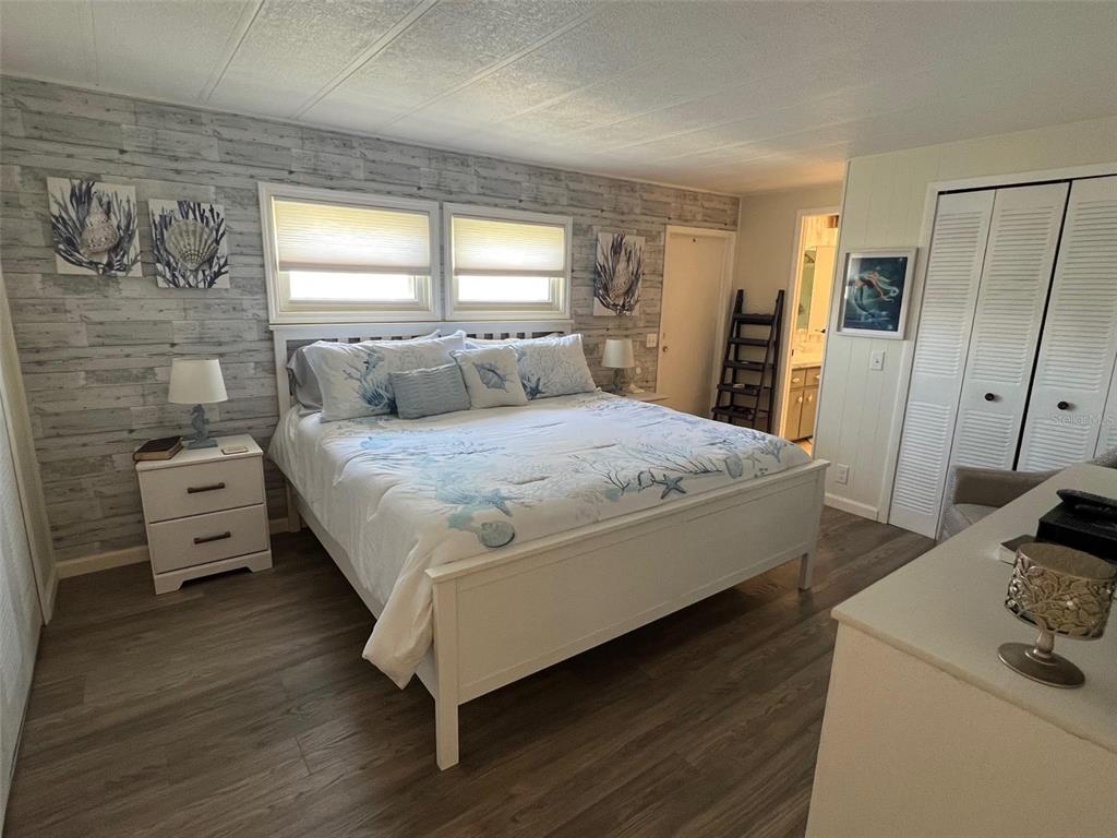 825 Coconut Palm Largo, FL 33778 - Photo 20 of 30 a bedroom with a bed and a dresser