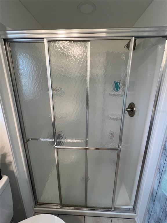 825 Coconut Palm Largo, FL 33778 - Photo 22 of 30 a bathroom with a glass door