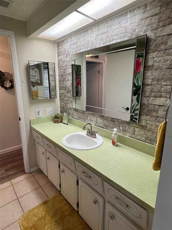 825 Coconut Palm Largo, FL 33778 - Photo 29 of 30 a bathroom with a sink and a mirror