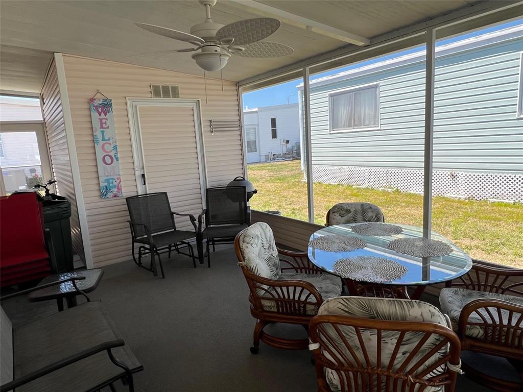 825 Coconut Palm Largo, FL 33778 - Photo 5 of 30 a view of a dining room with furniture window and outside view