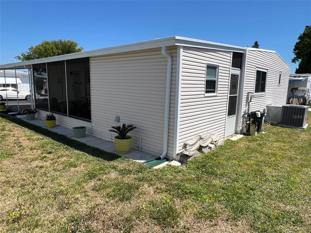 825 Coconut Palm Largo, FL 33778 - Photo 6 of 30 a front view of a house with garden