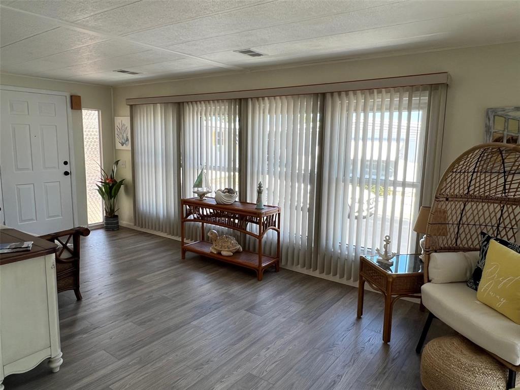 825 Coconut Palm Largo, FL 33778 - Photo 7 of 30 a living room with furniture and wooden floor
