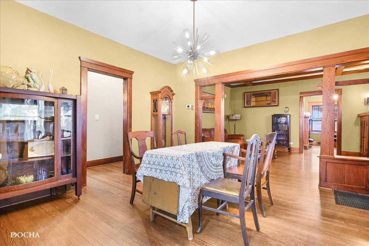 8725 Plattville Road Newark, IL 60541 - Photo 13 of 34 a view of a dining room with furniture and wooden floor
