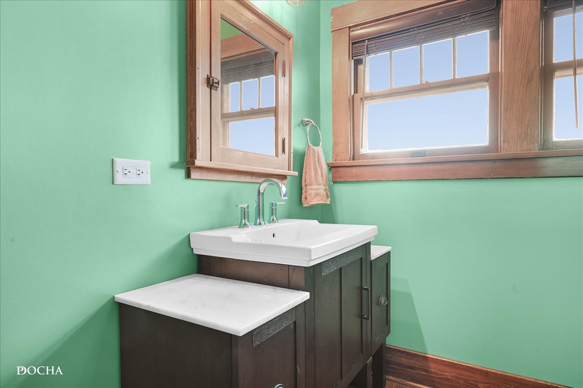 8725 Plattville Road Newark, IL 60541 - Photo 20 of 34 a bathroom with a sink and a mirror