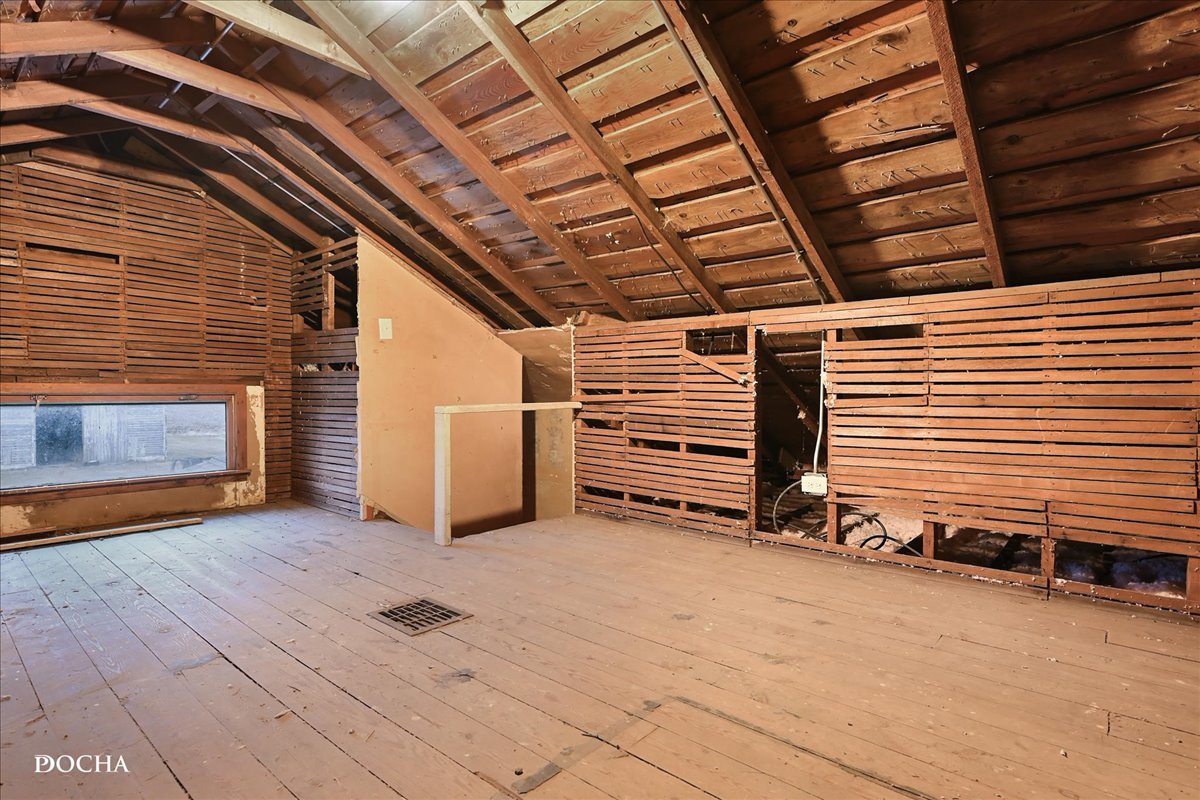 8725 Plattville Road Newark, IL 60541 - Photo 22 of 34 a view of an empty room with wooden floor and a fireplace