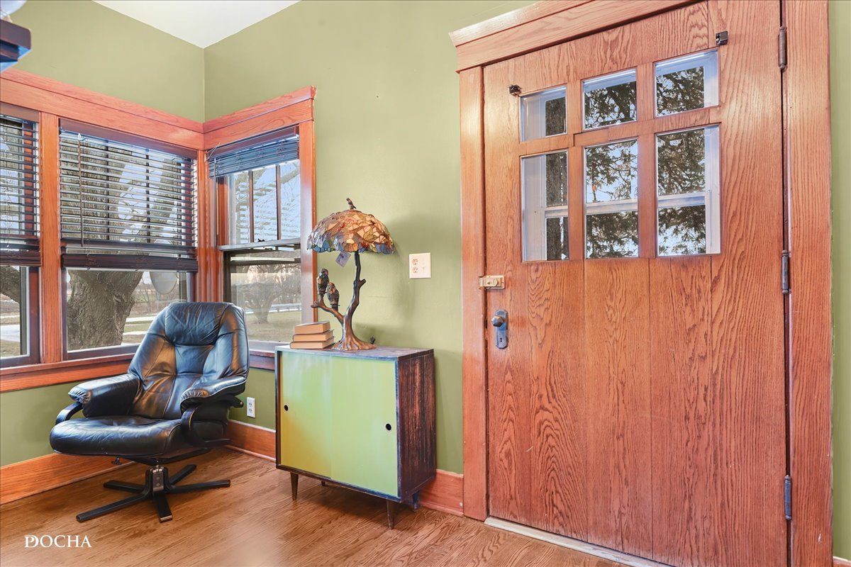 8725 Plattville Road Newark, IL 60541 - Photo 10 of 34 a living room with furniture and a large window
