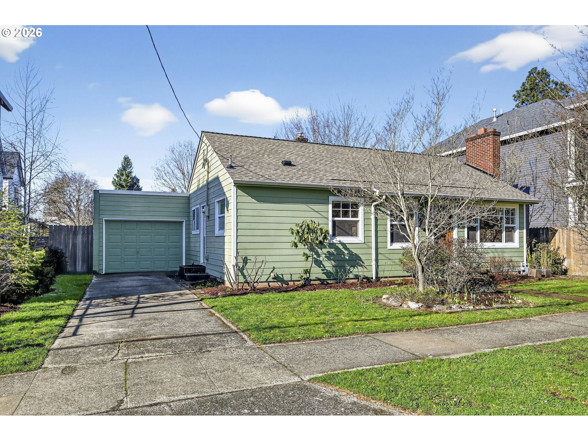5617 Southeast 60th Avenue Portland, OR 97206 - Photo 2 of 34 a front view of a house with garden
