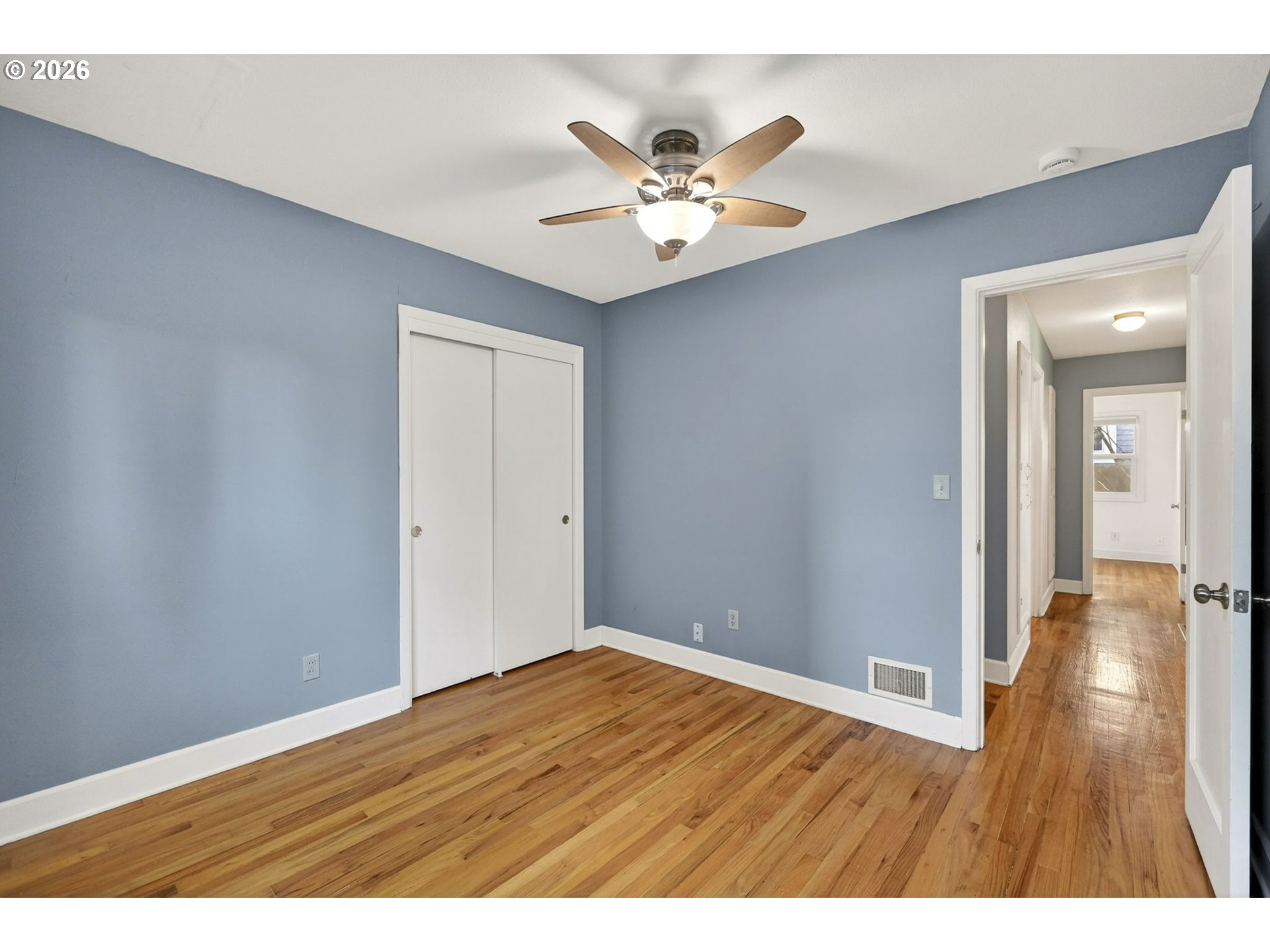 5617 Southeast 60th Avenue Portland, OR 97206 - Photo 22 of 34 a view of an empty room with wooden floor