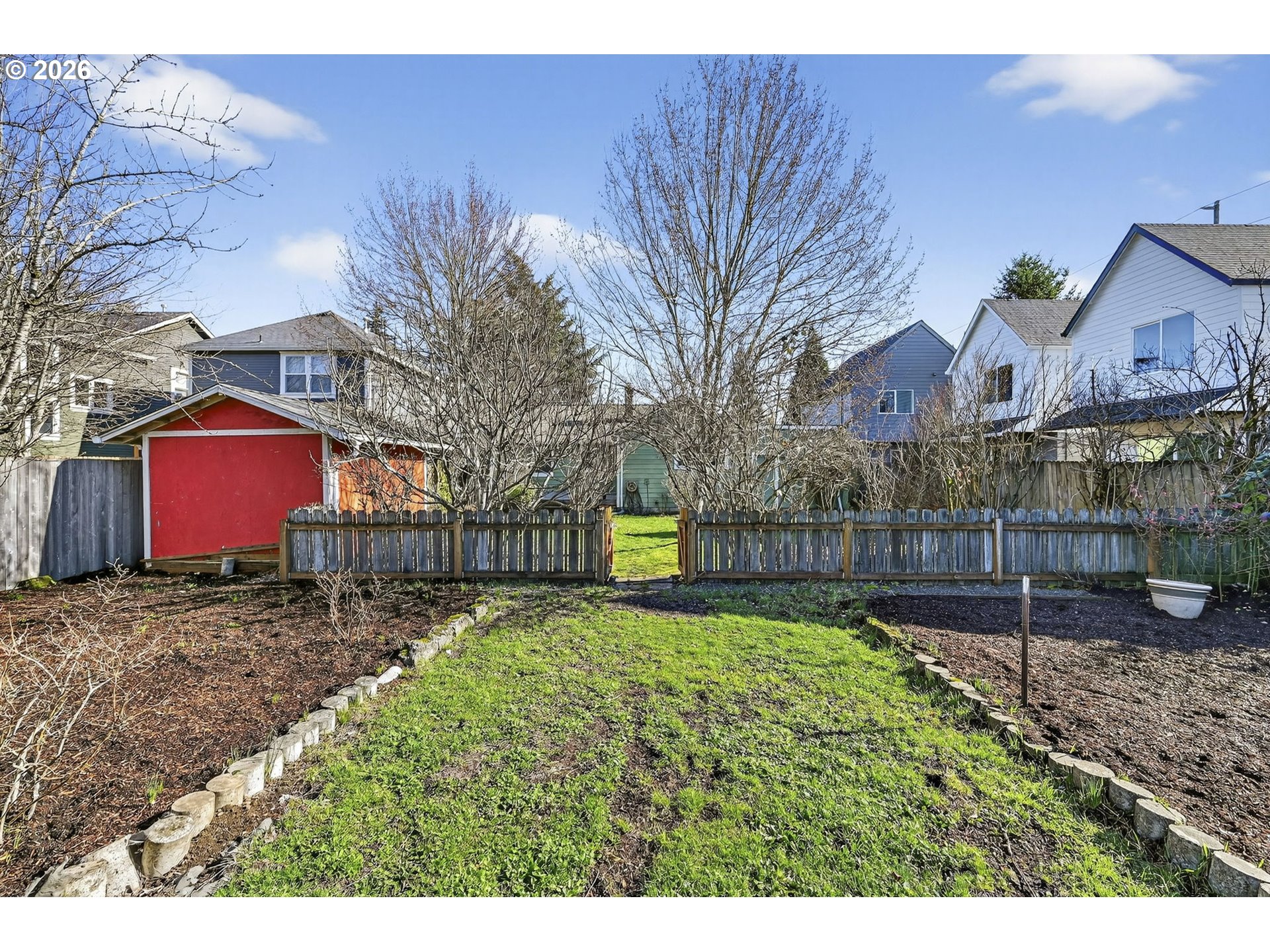 5617 Southeast 60th Avenue Portland, OR 97206 - Photo 26 of 34 a garden view with tall trees