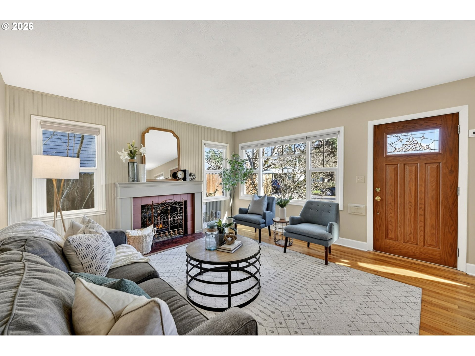 5617 Southeast 60th Avenue Portland, OR 97206 - Photo 3 of 34 a living room with furniture and a fireplace