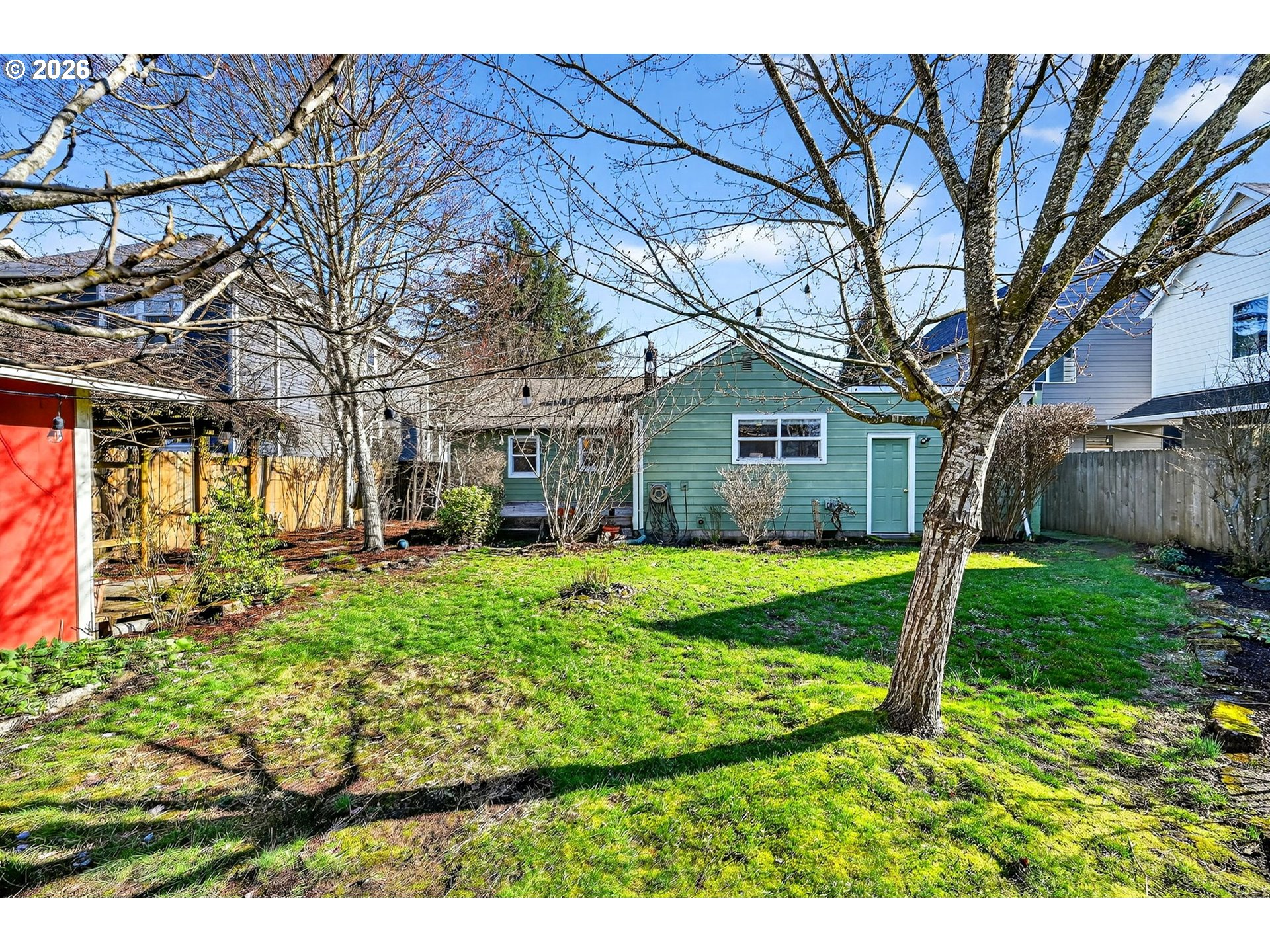 5617 Southeast 60th Avenue Portland, OR 97206 - Photo 31 of 34 a view of a house with backyard and a tree