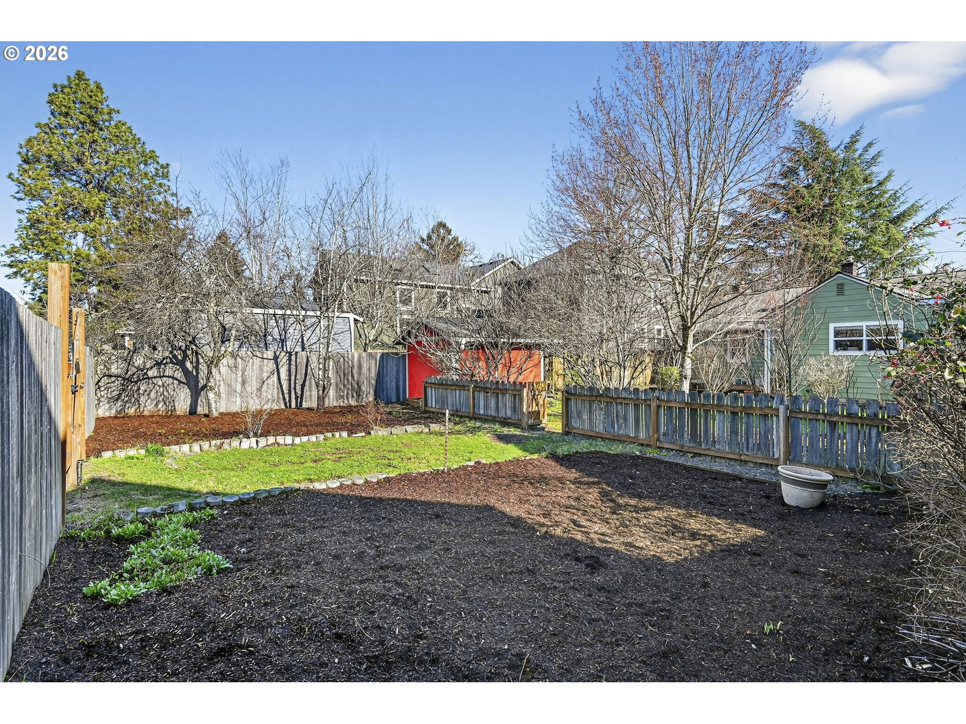 5617 Southeast 60th Avenue Portland, OR 97206 - Photo 34 of 34 a view of a backyard with large trees