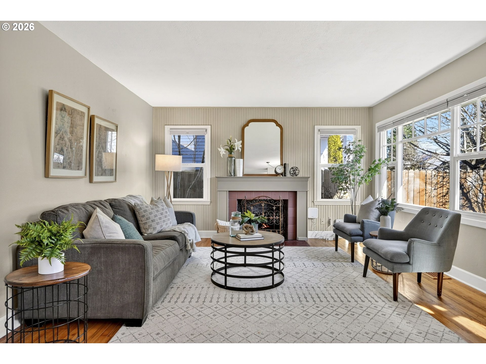 5617 Southeast 60th Avenue Portland, OR 97206 - Photo 5 of 34 a living room with furniture and a fireplace