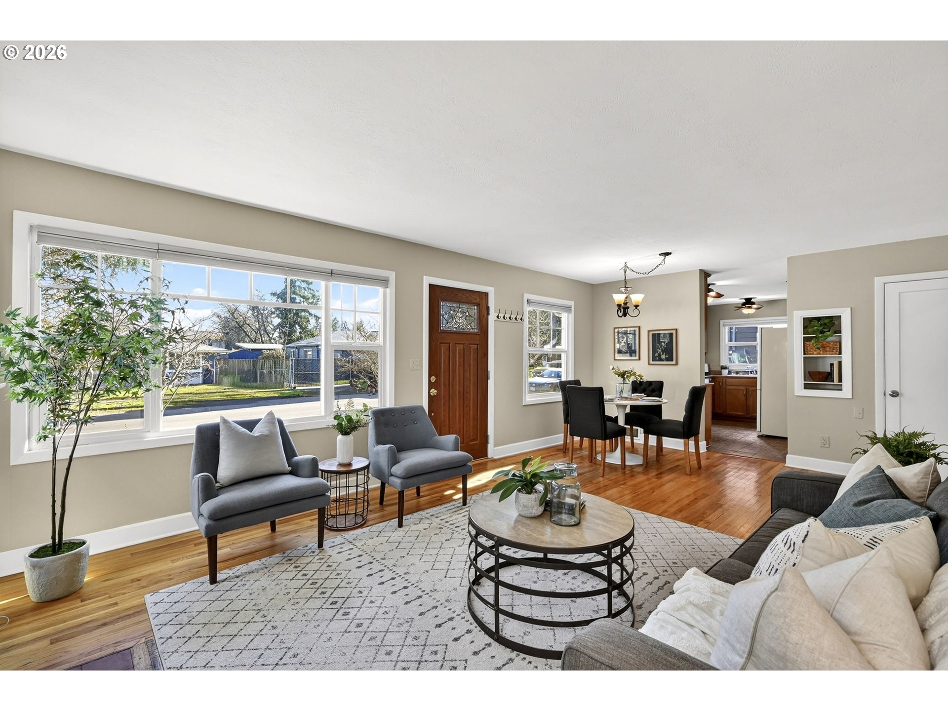 5617 Southeast 60th Avenue Portland, OR 97206 - Photo 7 of 34 a living room with furniture and a large window