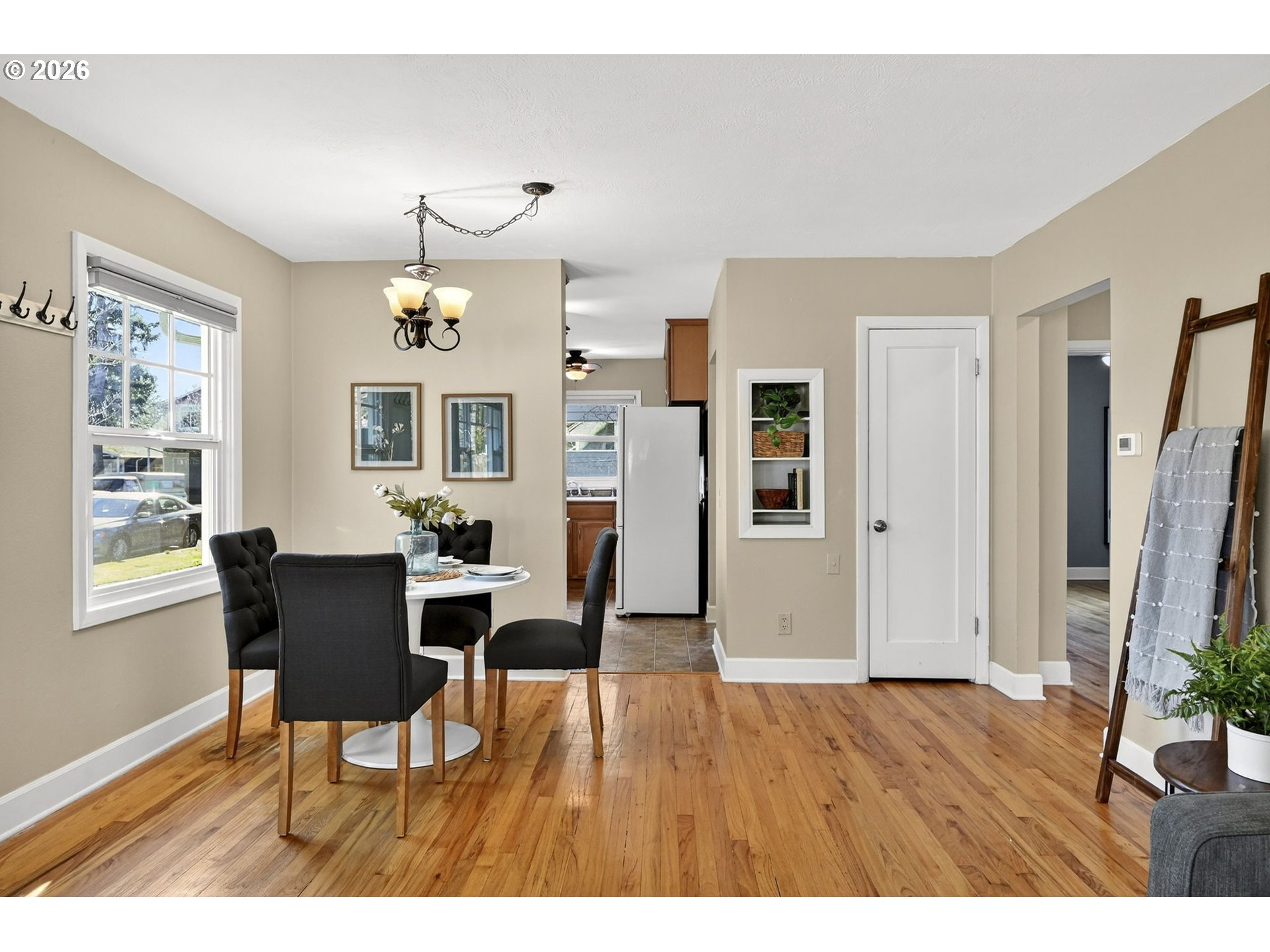 5617 Southeast 60th Avenue Portland, OR 97206 - Photo 10 of 34 a view of a dining room with furniture window and wooden floor