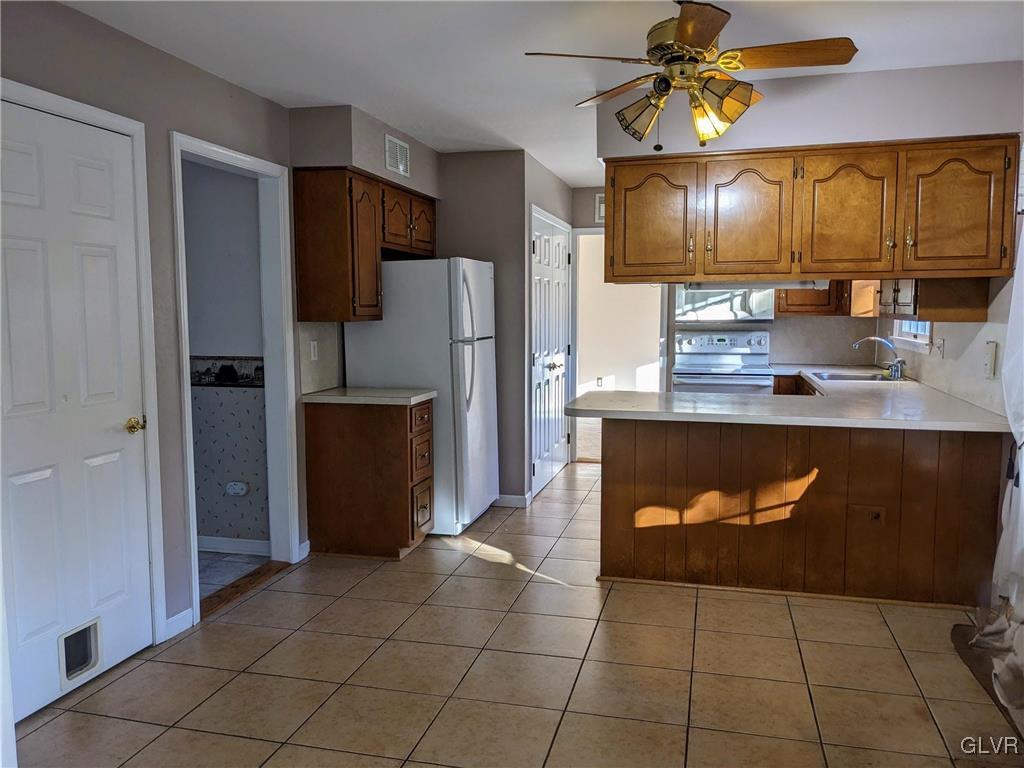 4422 Ammon Way Whitehall, PA 18052 - Photo 13 of 30 a kitchen with stainless steel appliances granite countertop a refrigerator a stove and a sink