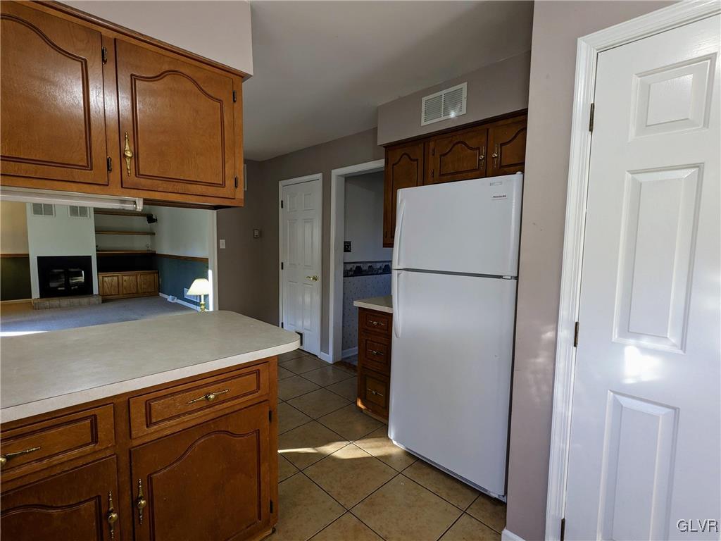 4422 Ammon Way Whitehall, PA 18052 - Photo 16 of 30 a kitchen with stainless steel appliances granite countertop a refrigerator and a sink
