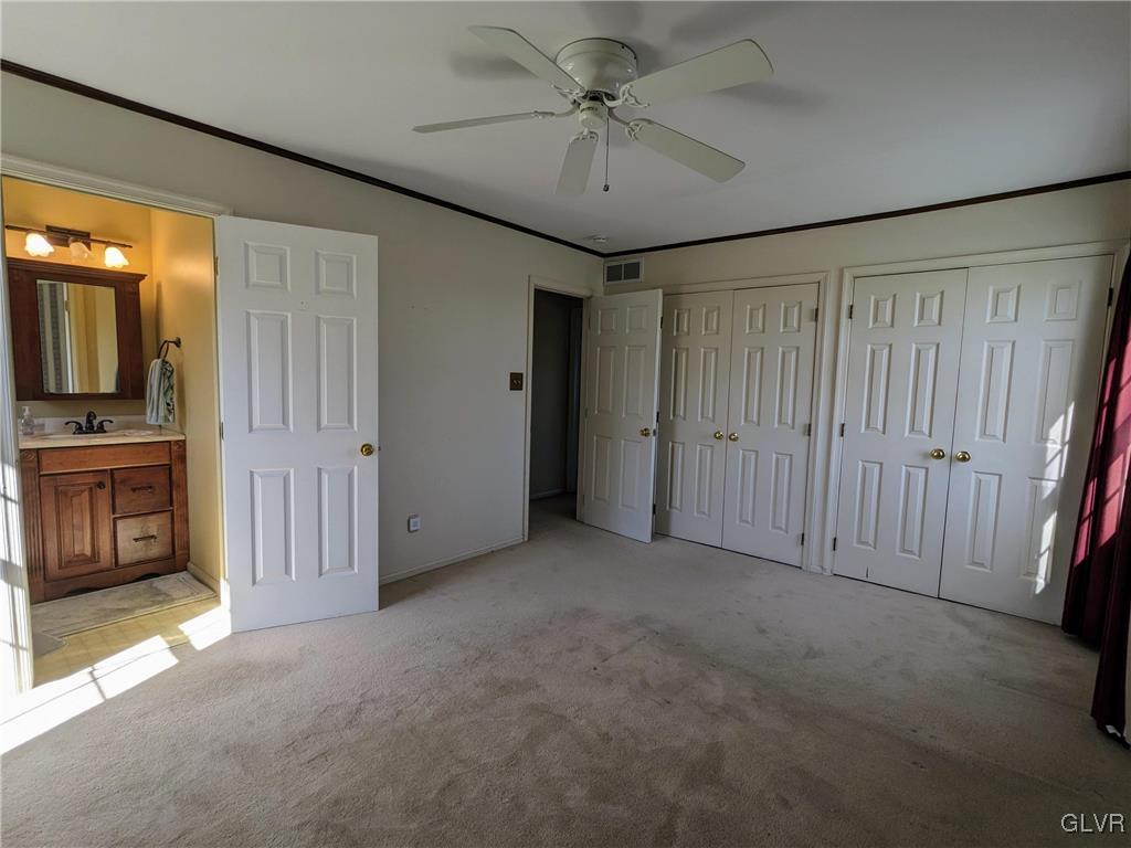 4422 Ammon Way Whitehall, PA 18052 - Photo 20 of 30 a view of a livingroom with a fireplace a chandelier fan and wooden floor