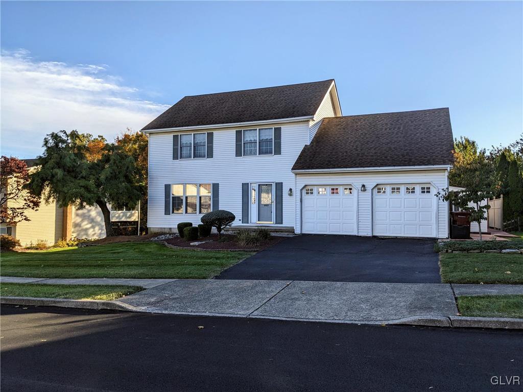 4422 Ammon Way Whitehall, PA 18052 - Photo 2 of 30 a front view of a house with a yard
