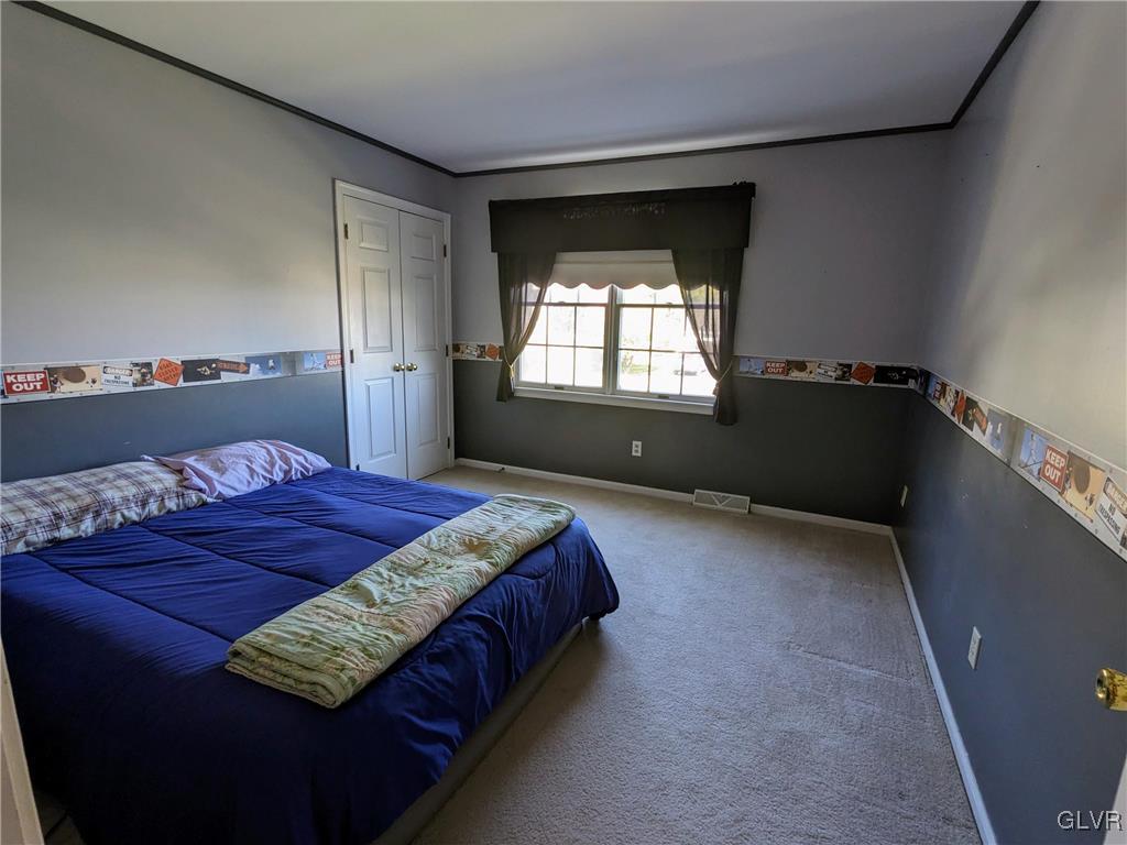 4422 Ammon Way Whitehall, PA 18052 - Photo 21 of 30 a bedroom with a bed and window
