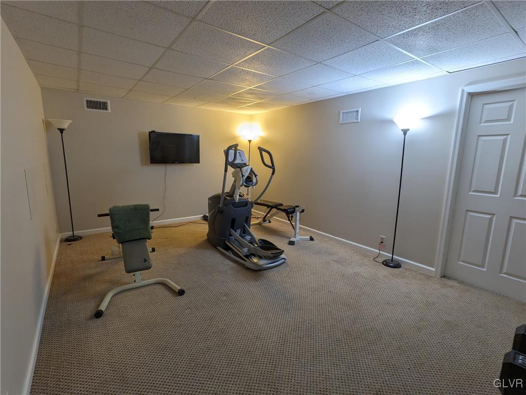 4422 Ammon Way Whitehall, PA 18052 - Photo 24 of 30 a room with gym equipment and a flat screen tv