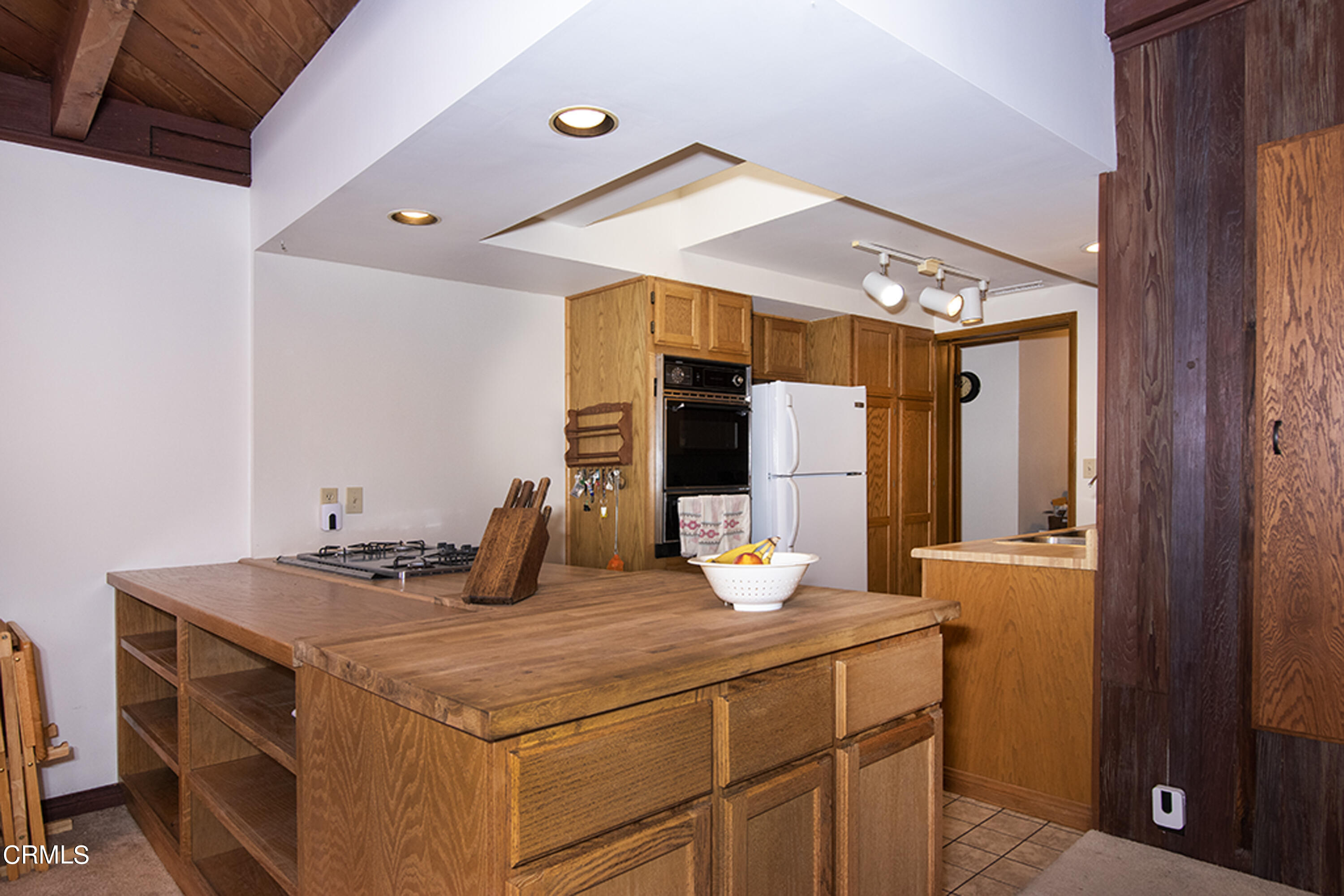 2888 Reposa Lane Altadena, CA 91001 - Photo 13 of 60 a kitchen with a sink cabinets and wooden floor