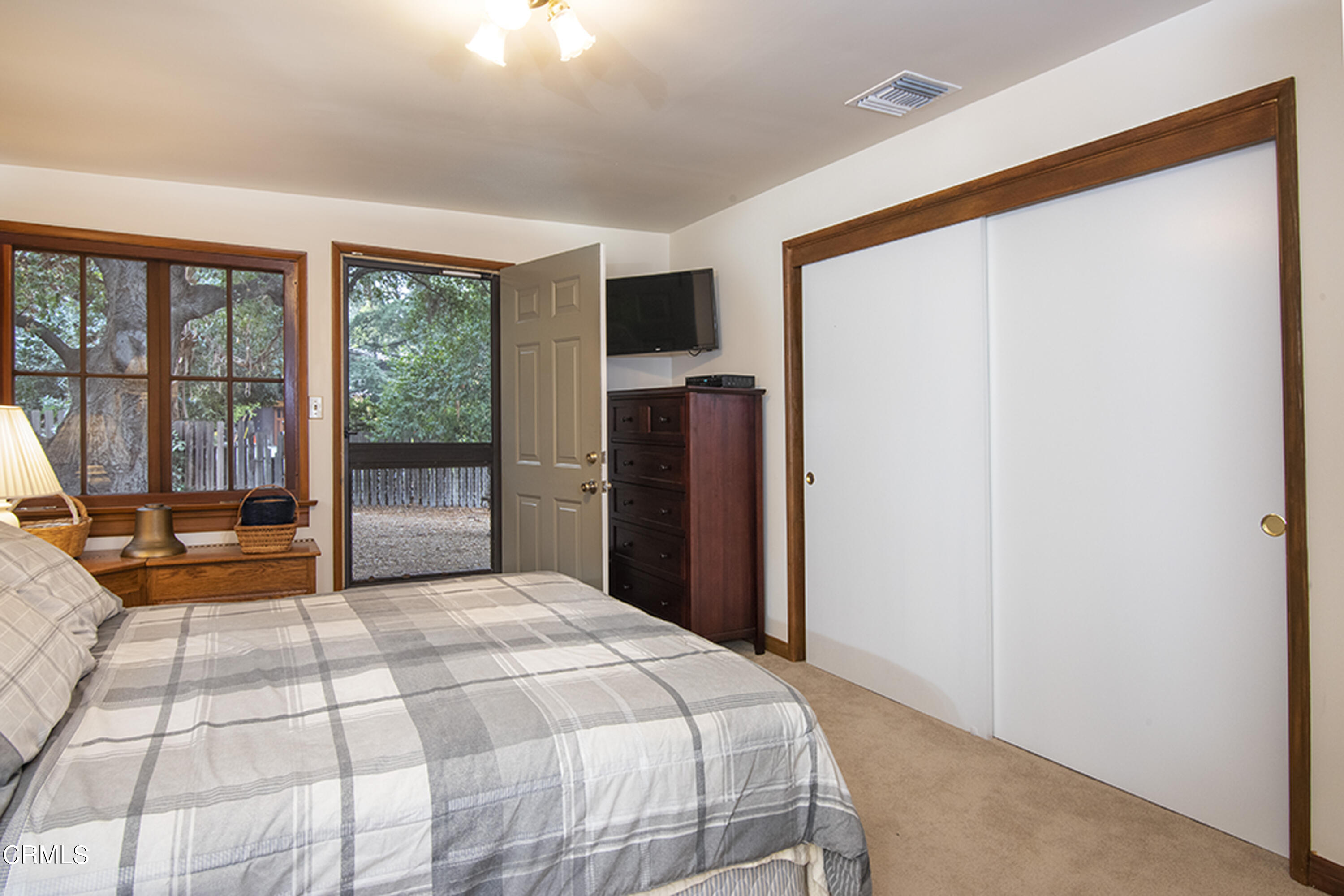 2888 Reposa Lane Altadena, CA 91001 - Photo 19 of 60 a bedroom with a large bed and a large window