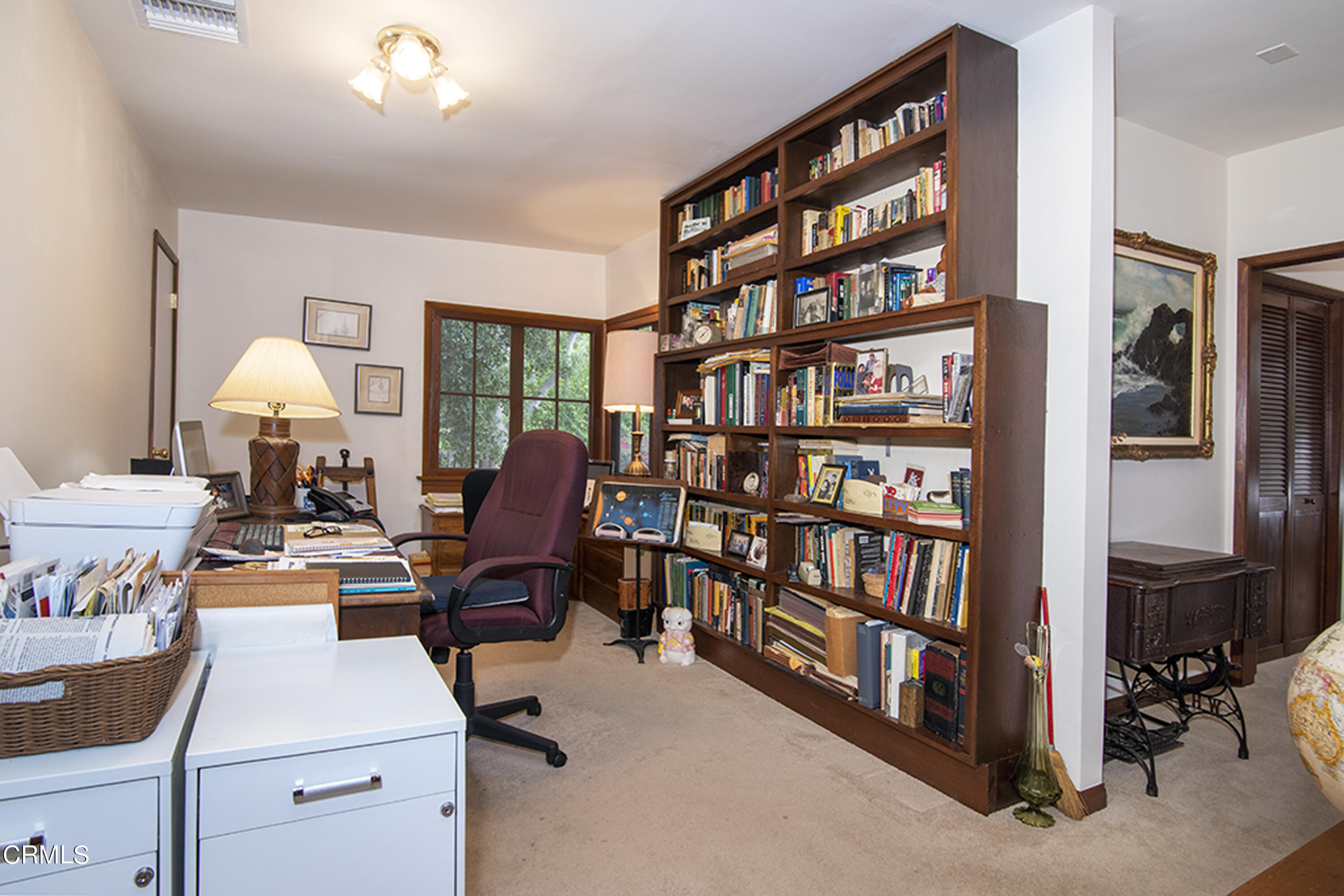 2888 Reposa Lane Altadena, CA 91001 - Photo 21 of 60 a view of a workspace with furniture and a bookshelf