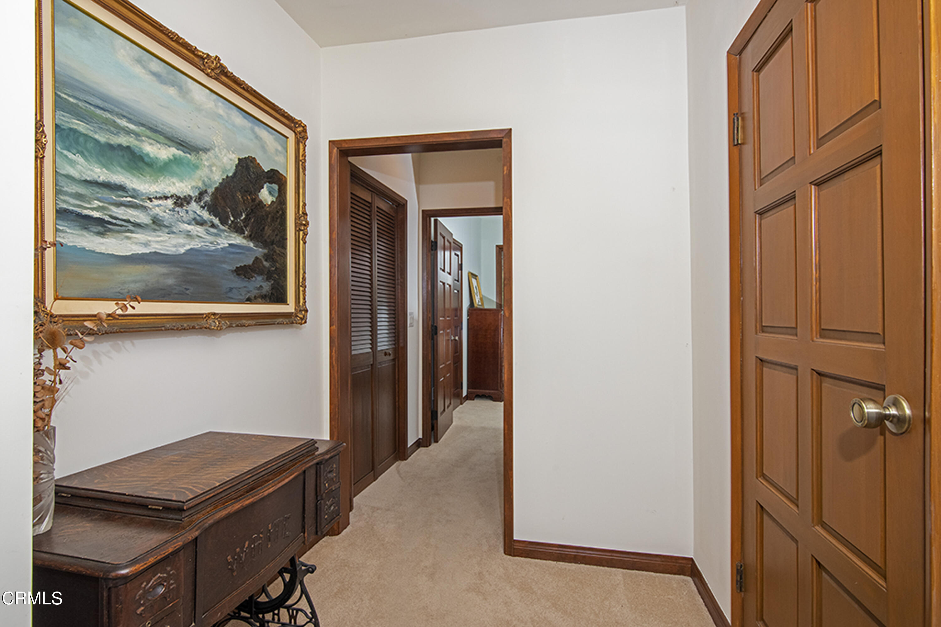 2888 Reposa Lane Altadena, CA 91001 - Photo 22 of 60 a view of a hallway with paintings on the wall