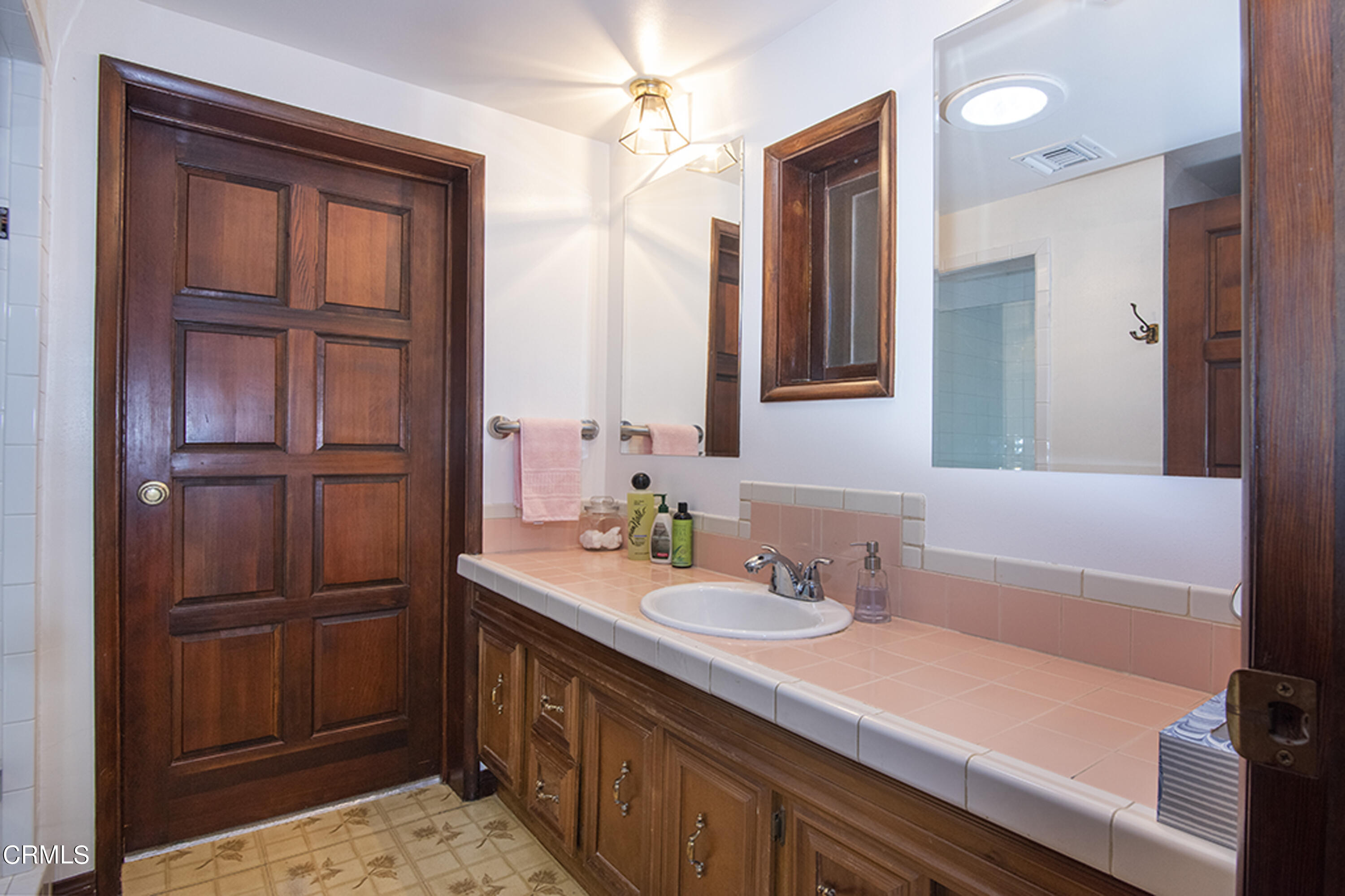 2888 Reposa Lane Altadena, CA 91001 - Photo 23 of 60 a bathroom with a sink a vanity and a mirror