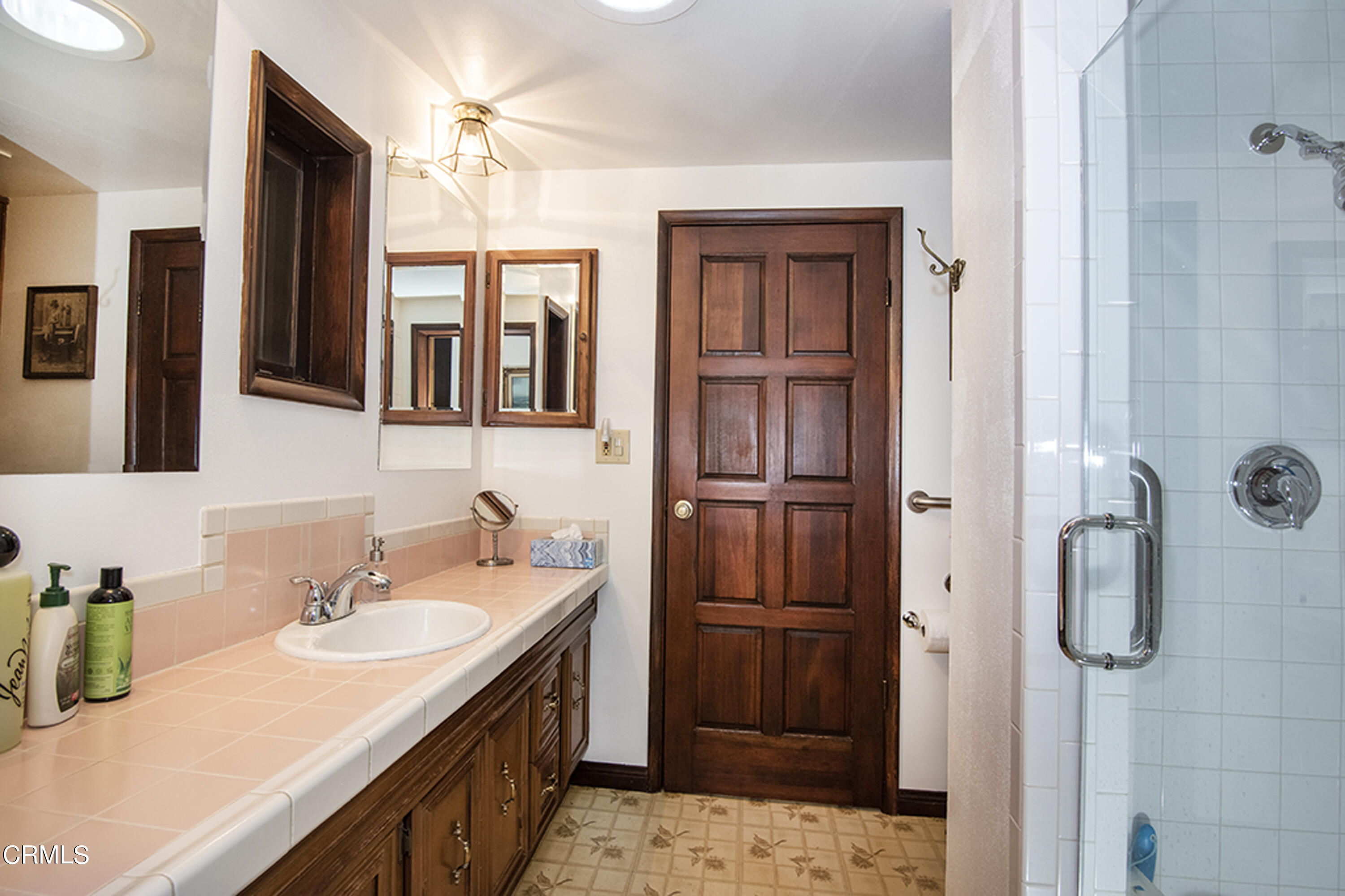 2888 Reposa Lane Altadena, CA 91001 - Photo 24 of 60 a bathroom with a sink double vanity and a shower