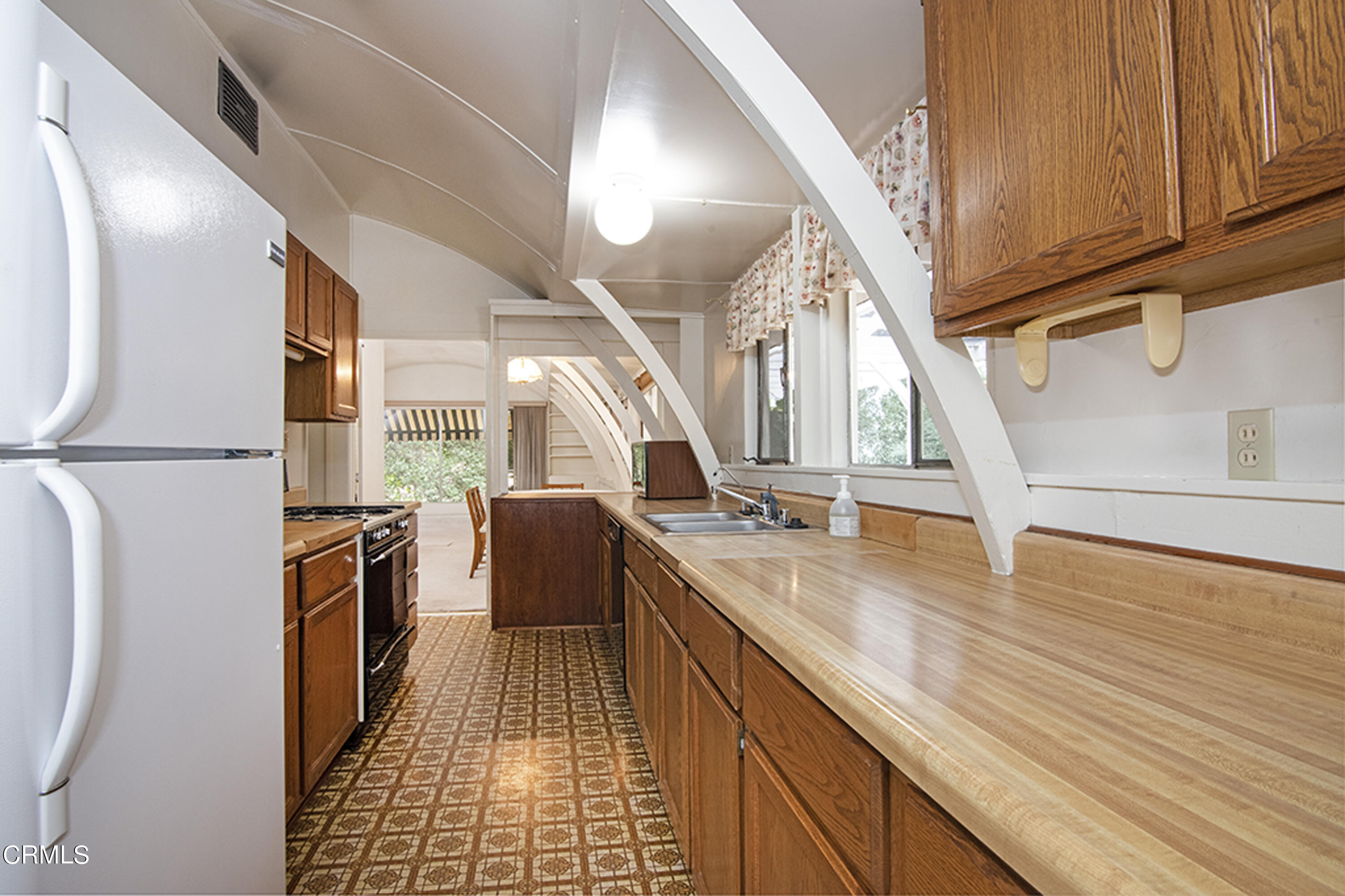 2888 Reposa Lane Altadena, CA 91001 - Photo 47 of 60 a kitchen with stainless steel appliances granite countertop a sink and dishwasher