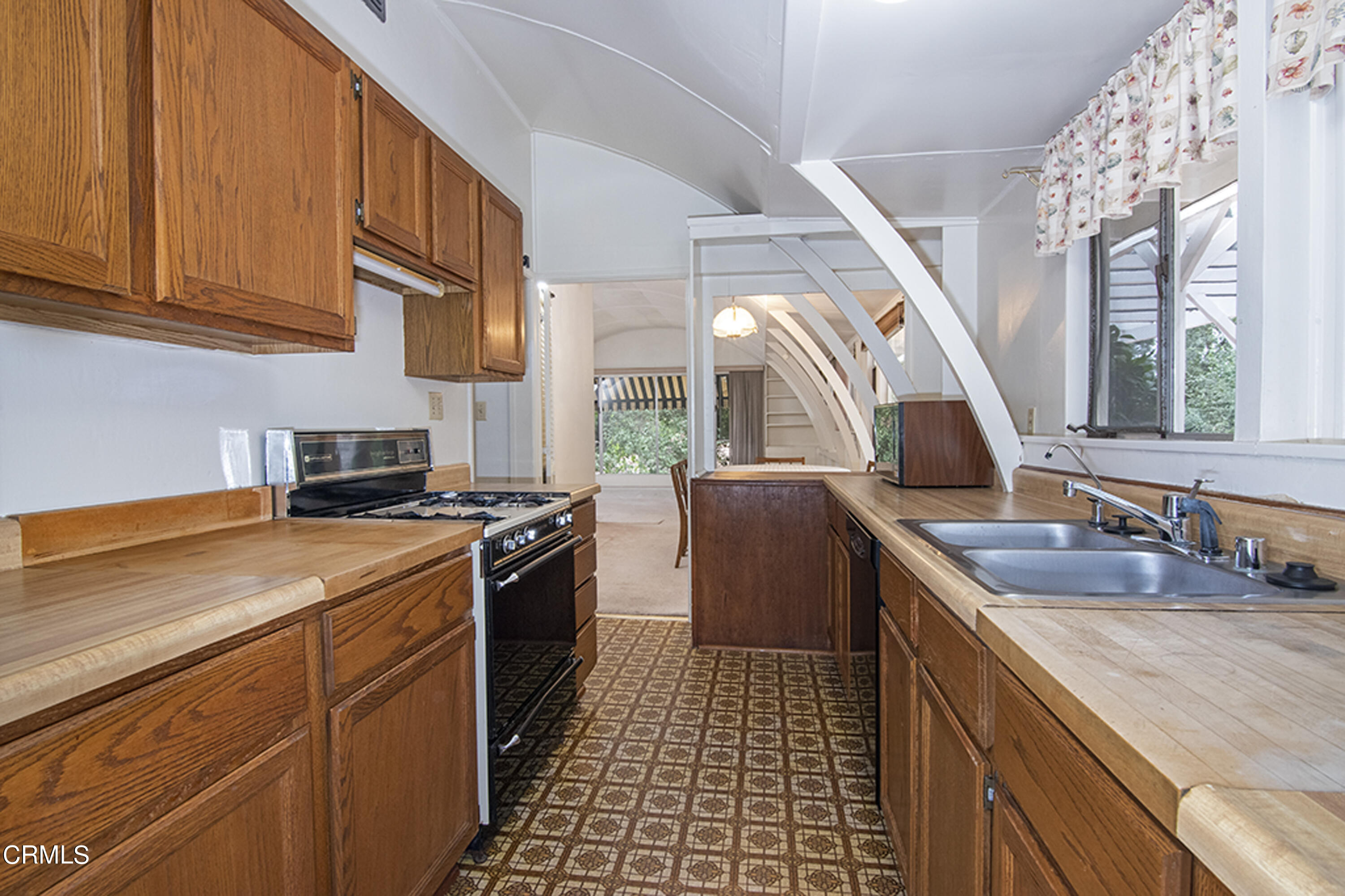 2888 Reposa Lane Altadena, CA 91001 - Photo 48 of 60 a kitchen with a sink stove and cabinets