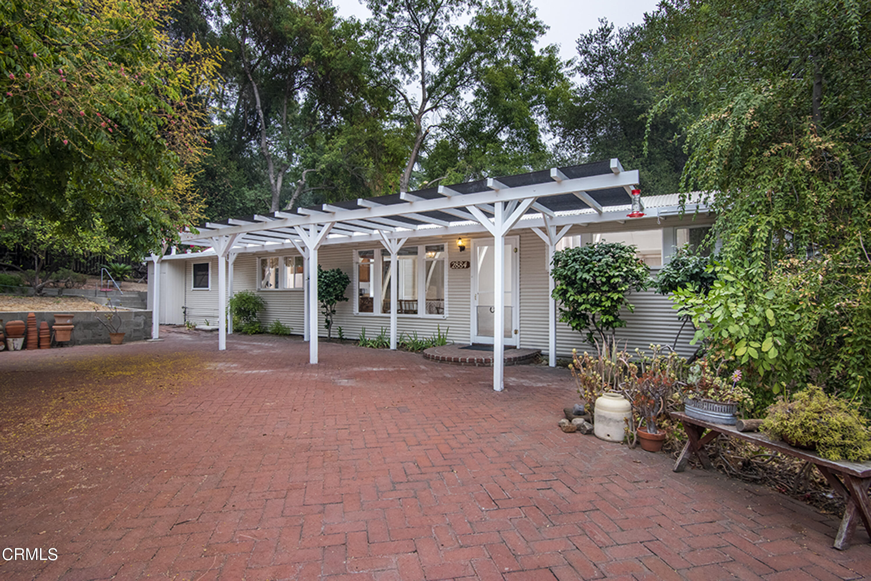 2888 Reposa Lane Altadena, CA 91001 - Photo 51 of 60 a patio with a table and chairs and potted plants