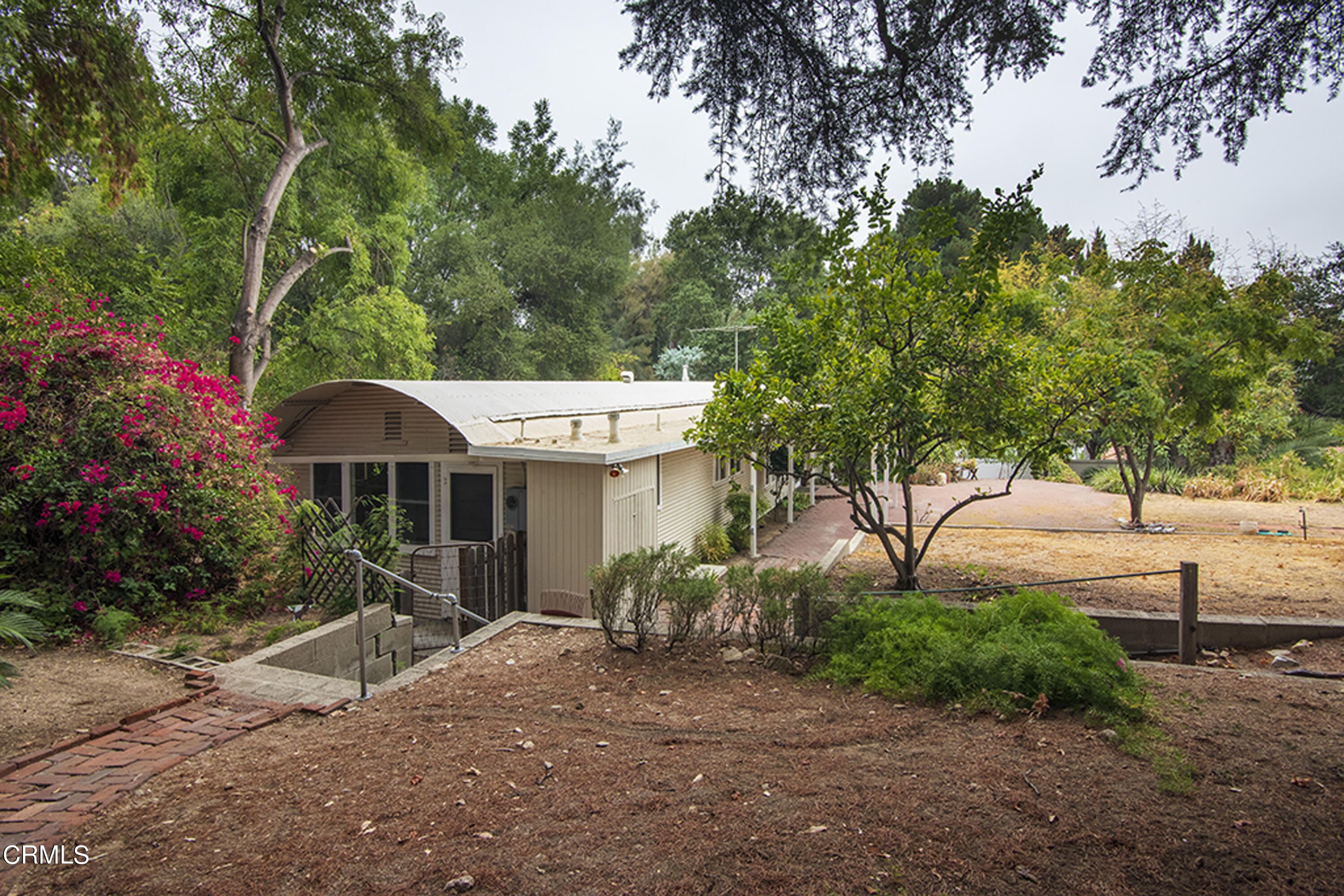 2888 Reposa Lane Altadena, CA 91001 - Photo 59 of 60 a view of a house with a tree and plants