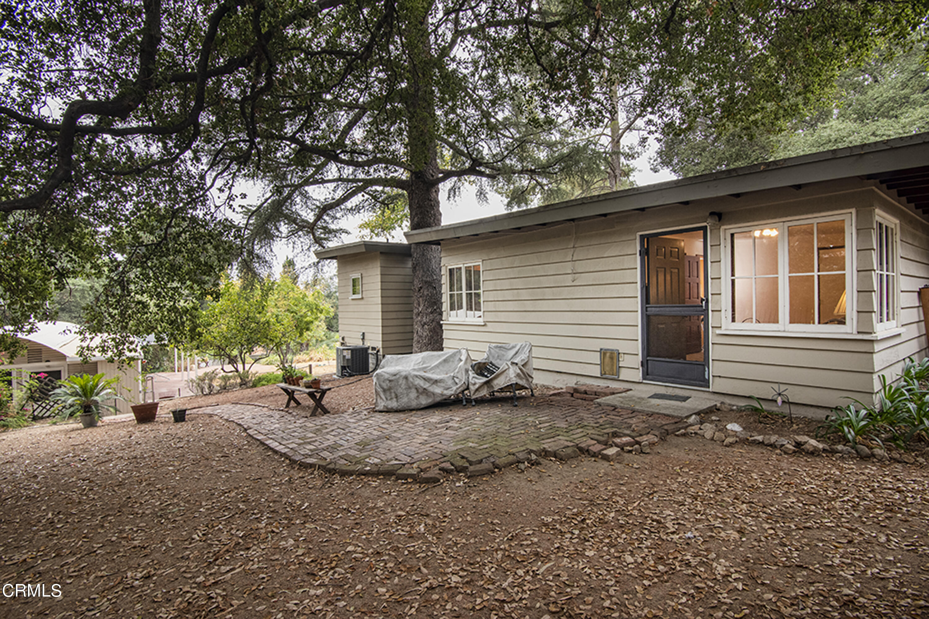 2888 Reposa Lane Altadena, CA 91001 - Photo 7 of 60 a backyard of a house with plants and trees
